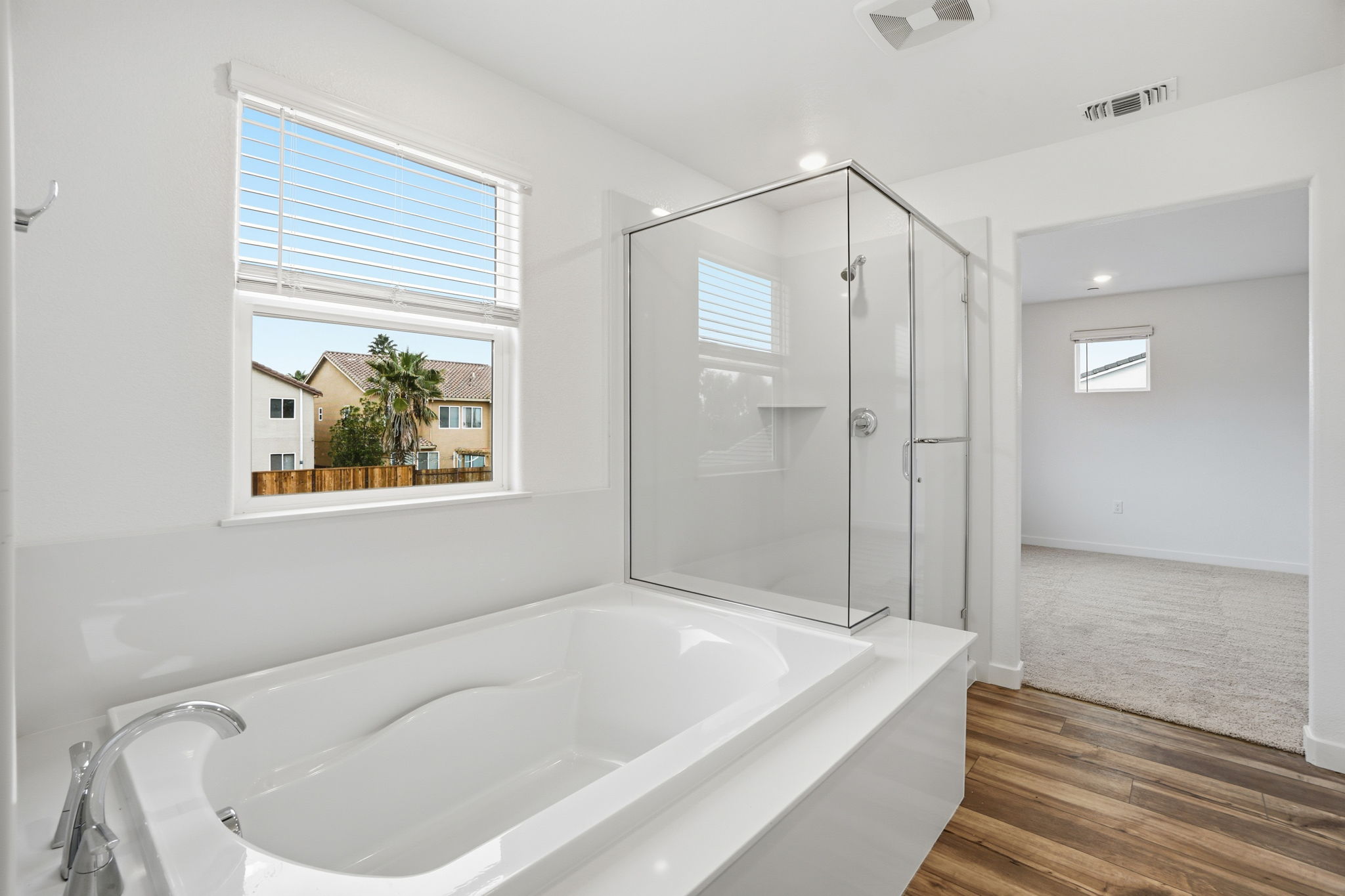 A bathroom with a tub and shower.
