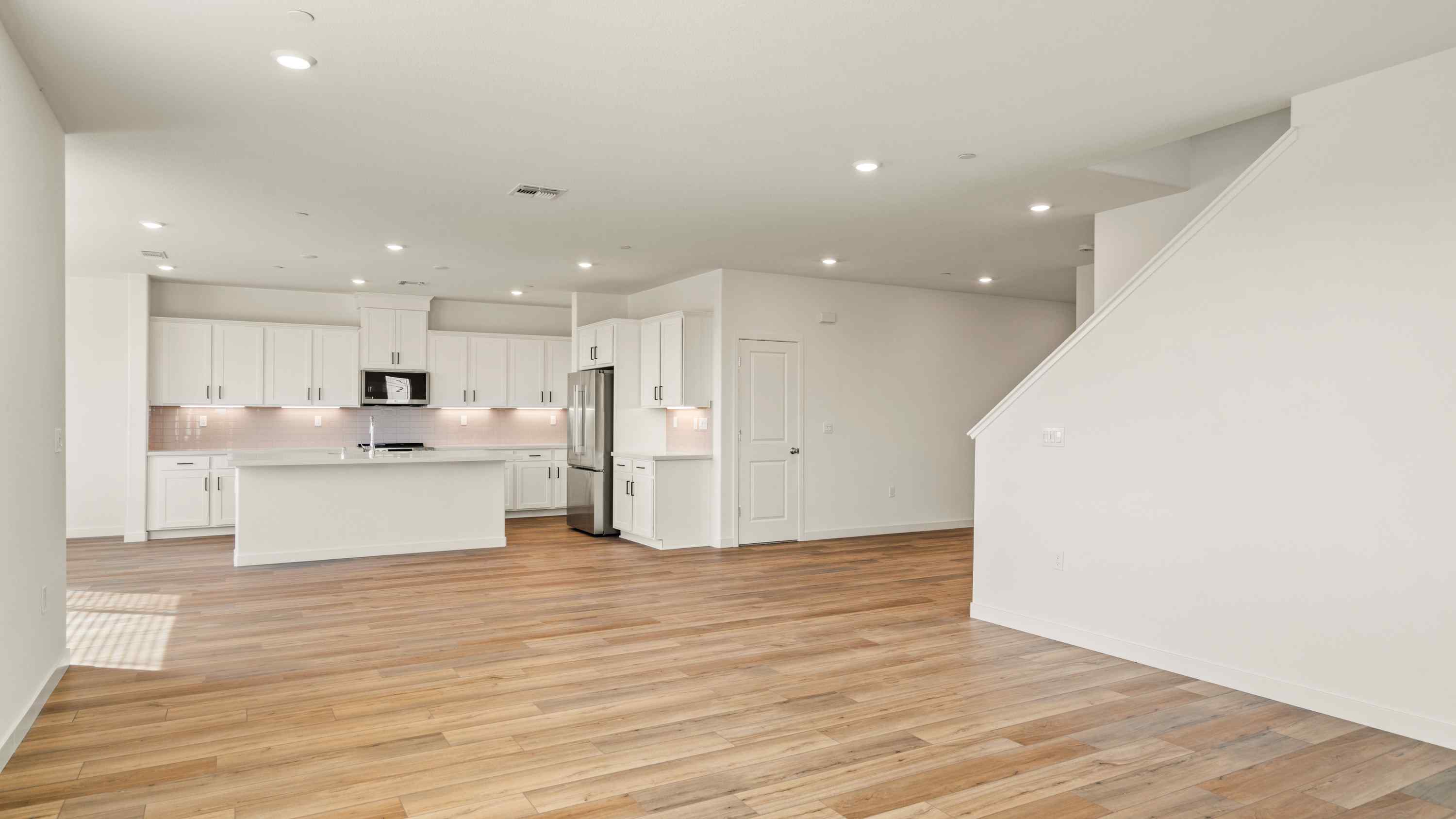 A large kitchen with white cabinets.
