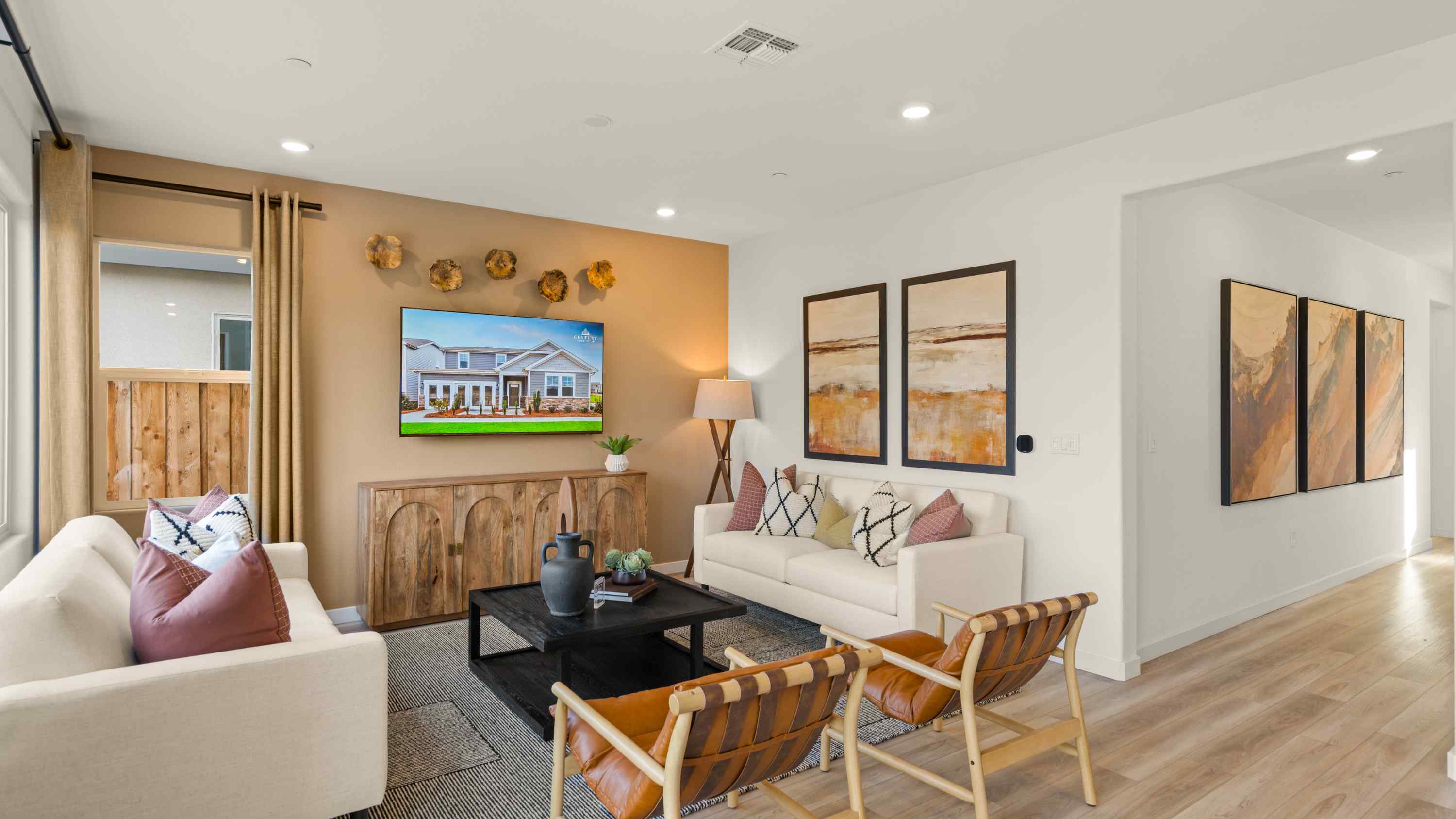 A living room with a tv and couches.