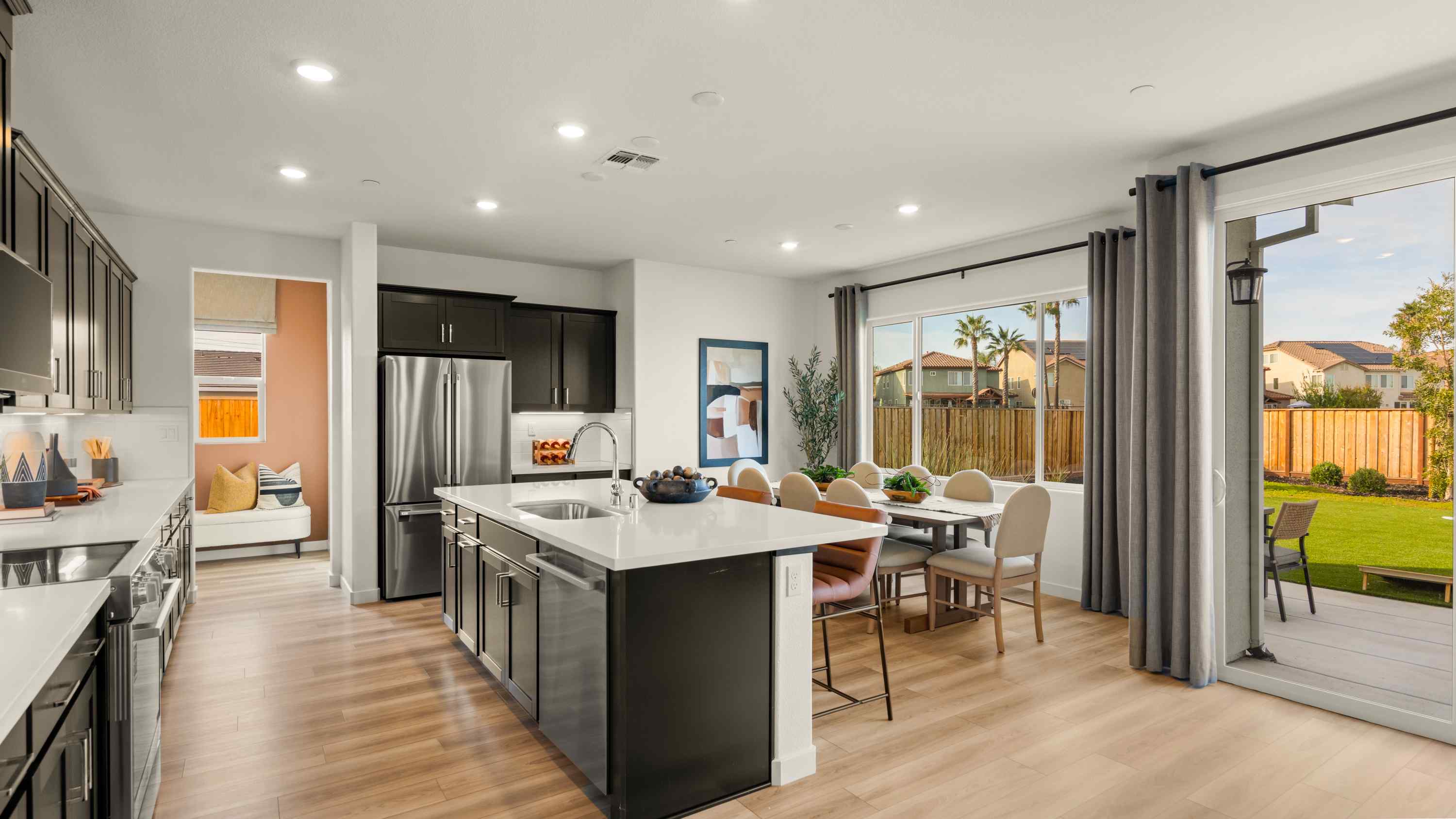 A kitchen with a large window.
