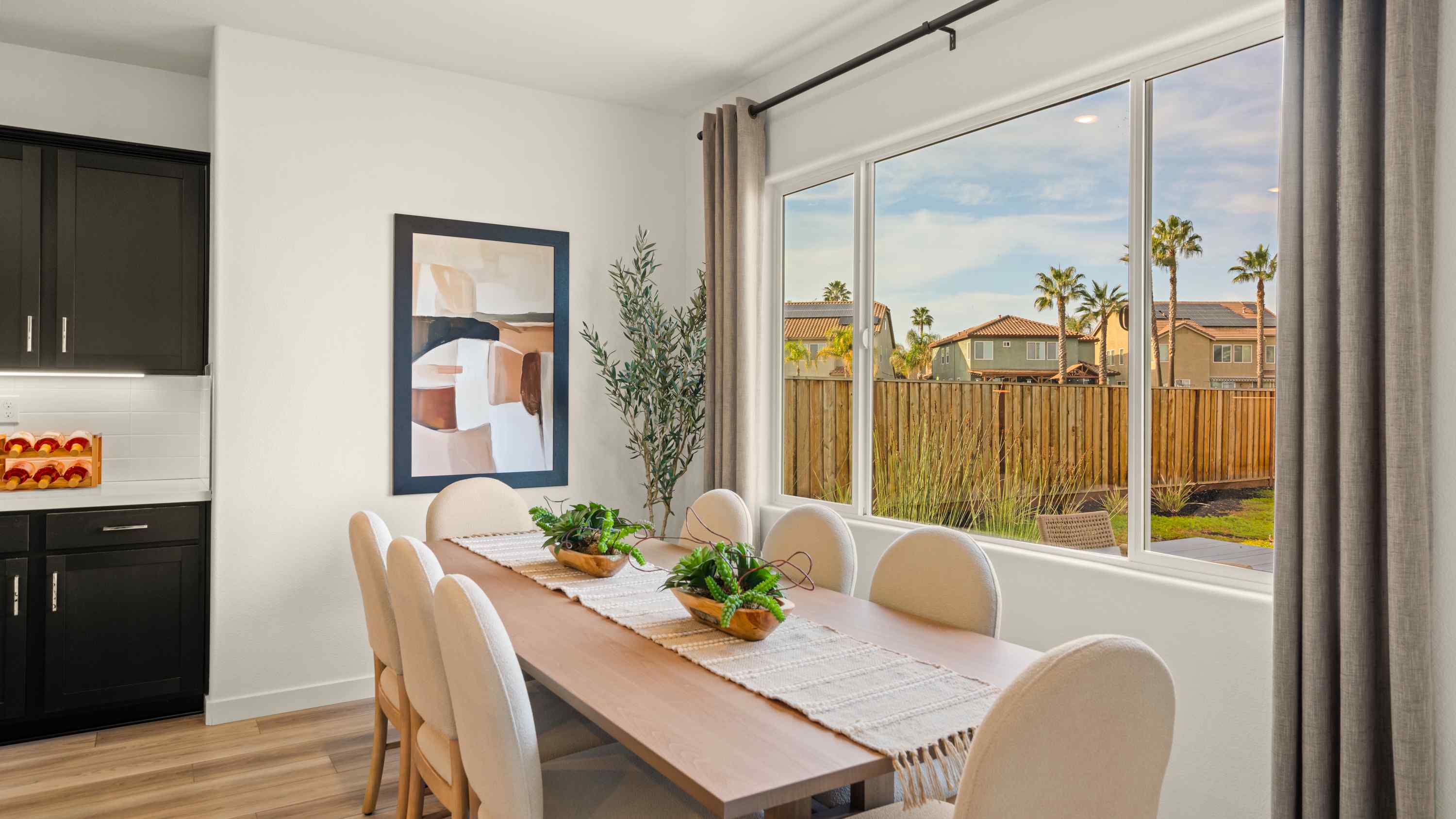 A dining room with a large window.