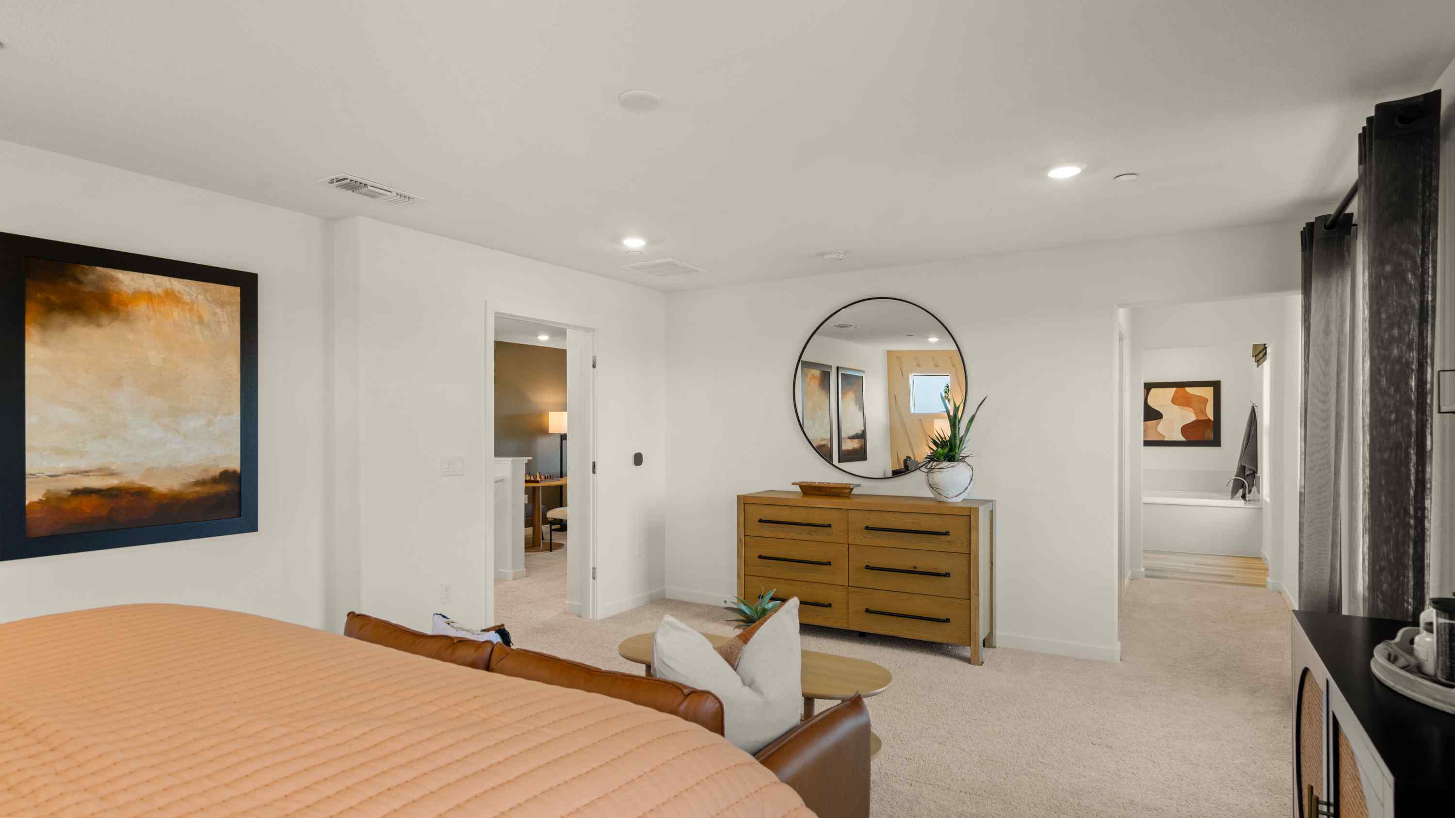 A bedroom with a bed and a desk.