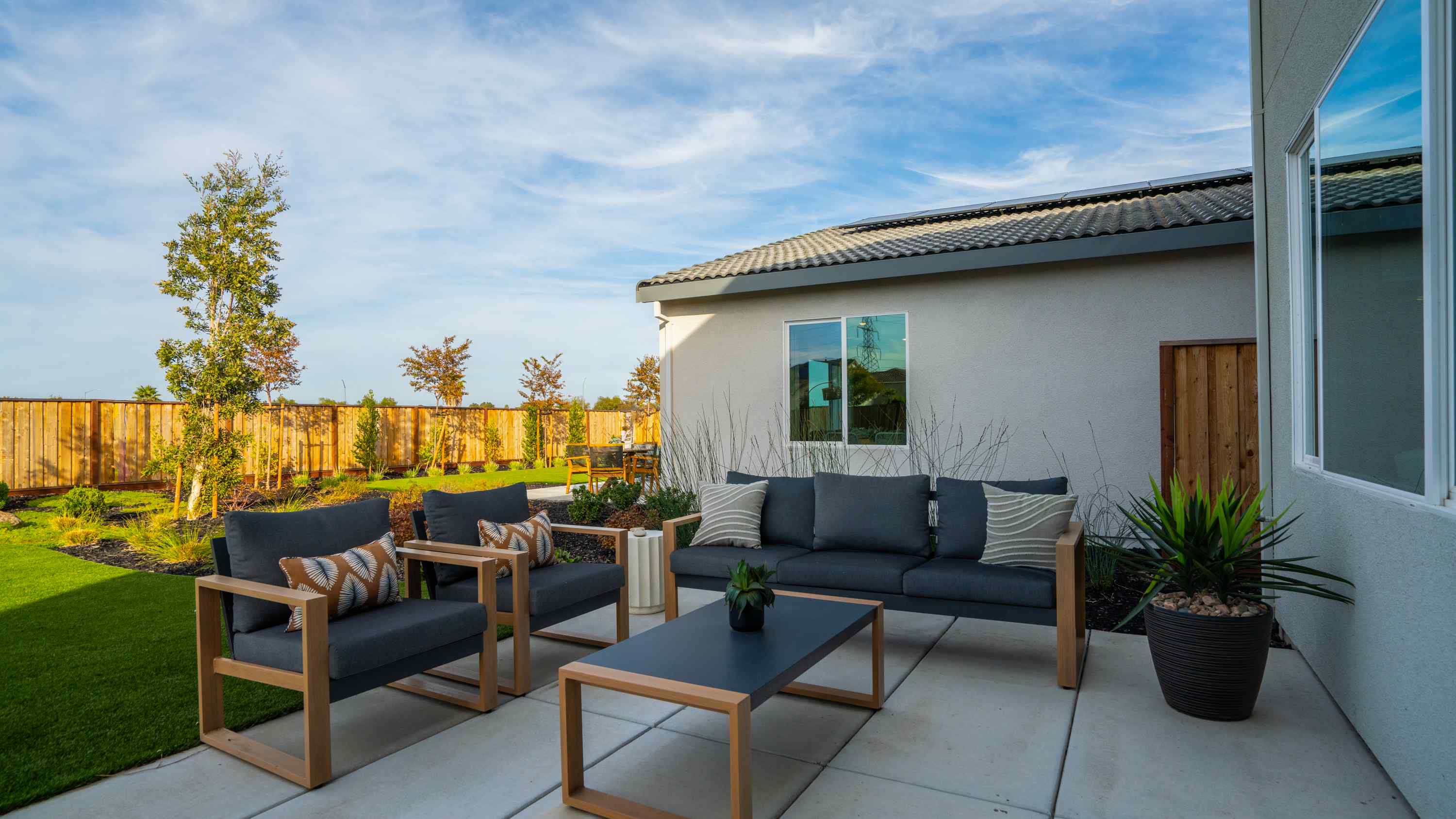A patio with a table and chairs.