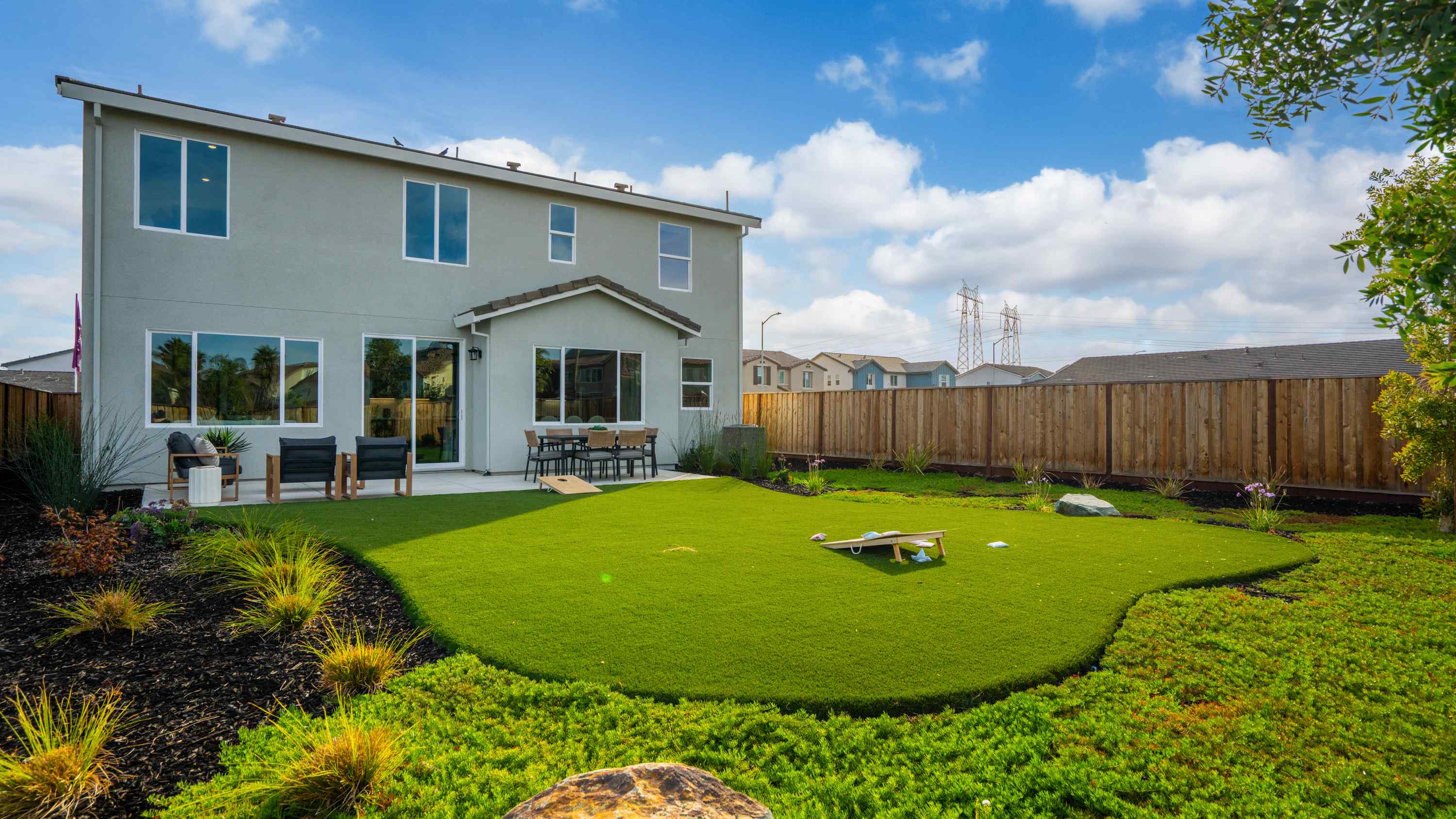 A house with a fence and yard.