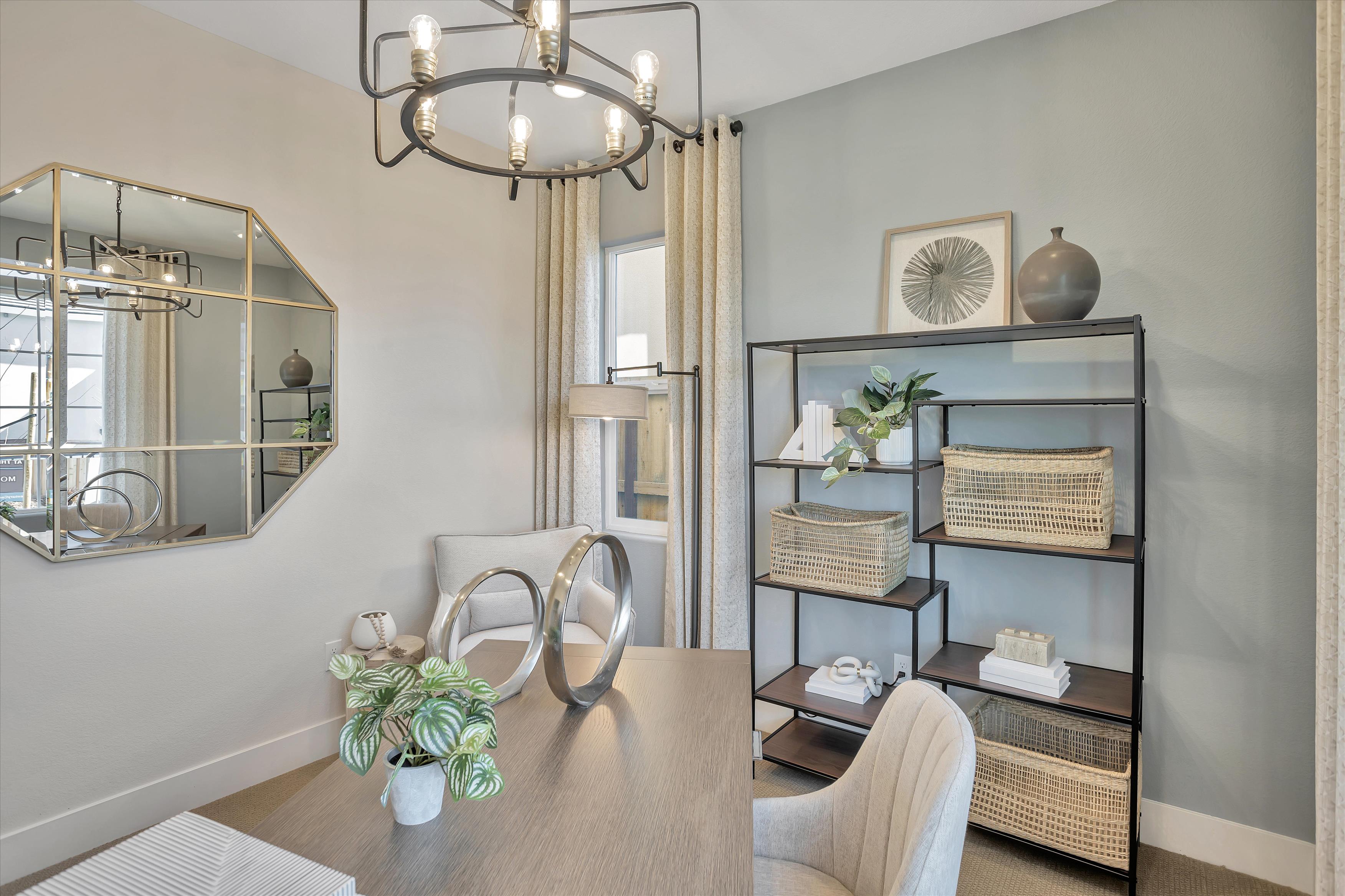 A room with a table and chairs.