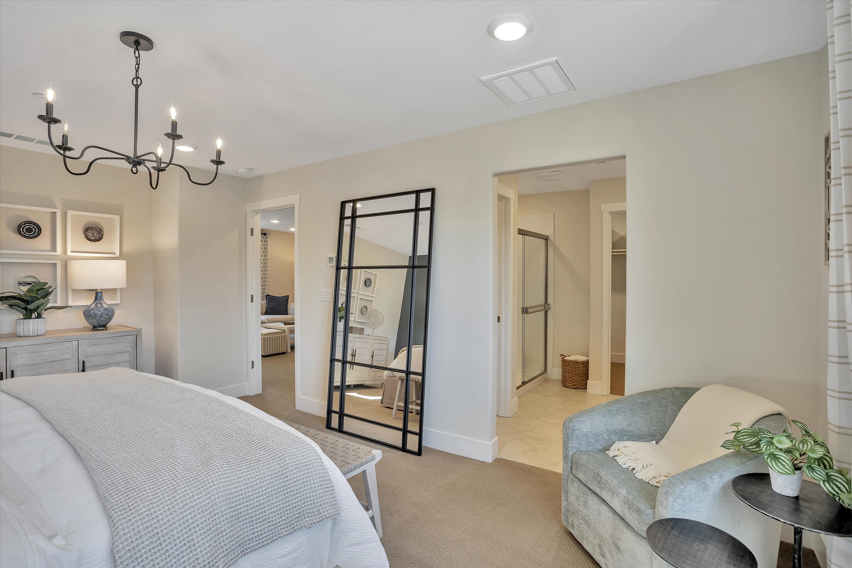 A living room with a bed and a couch.
