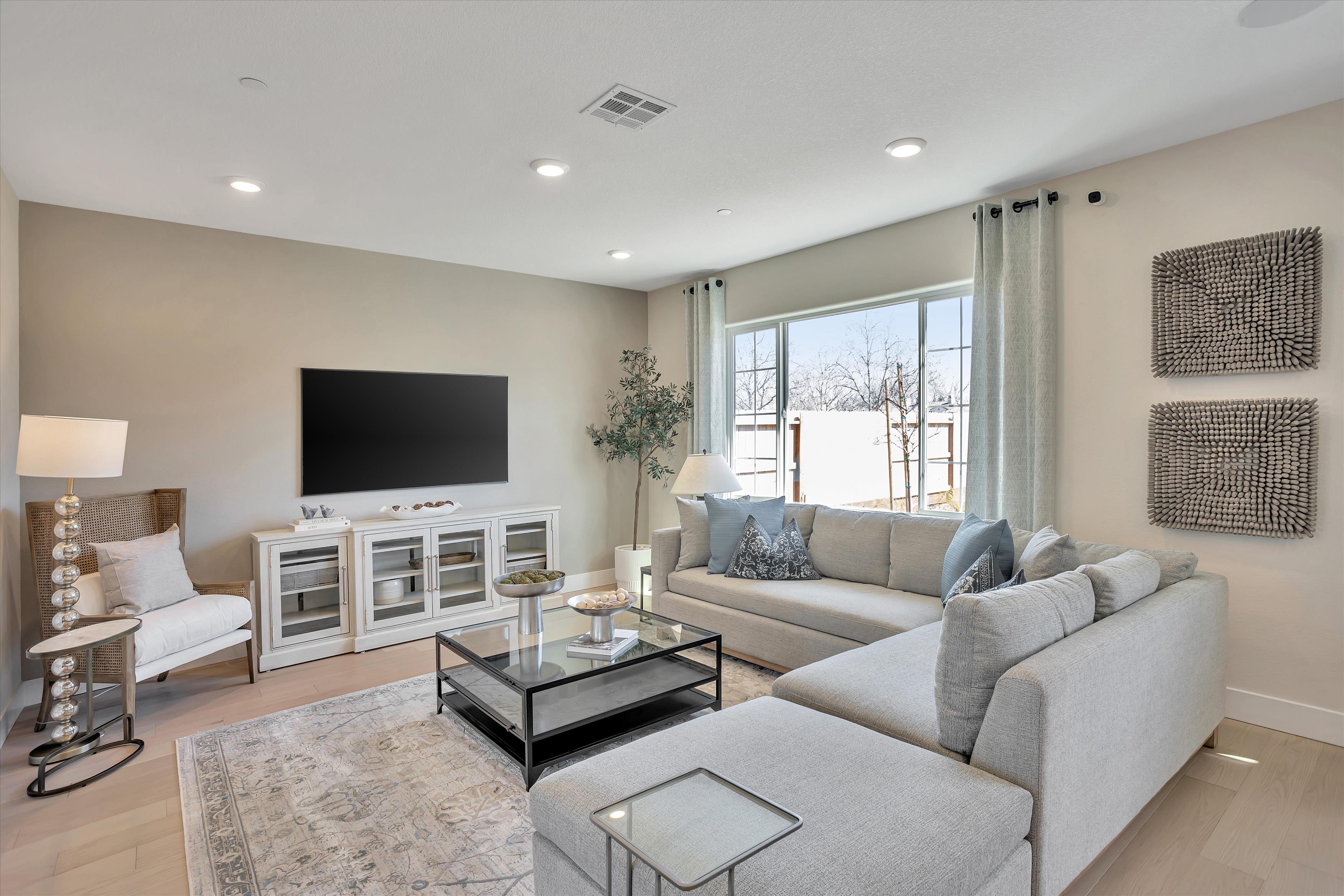 A living room with a tv and couches.