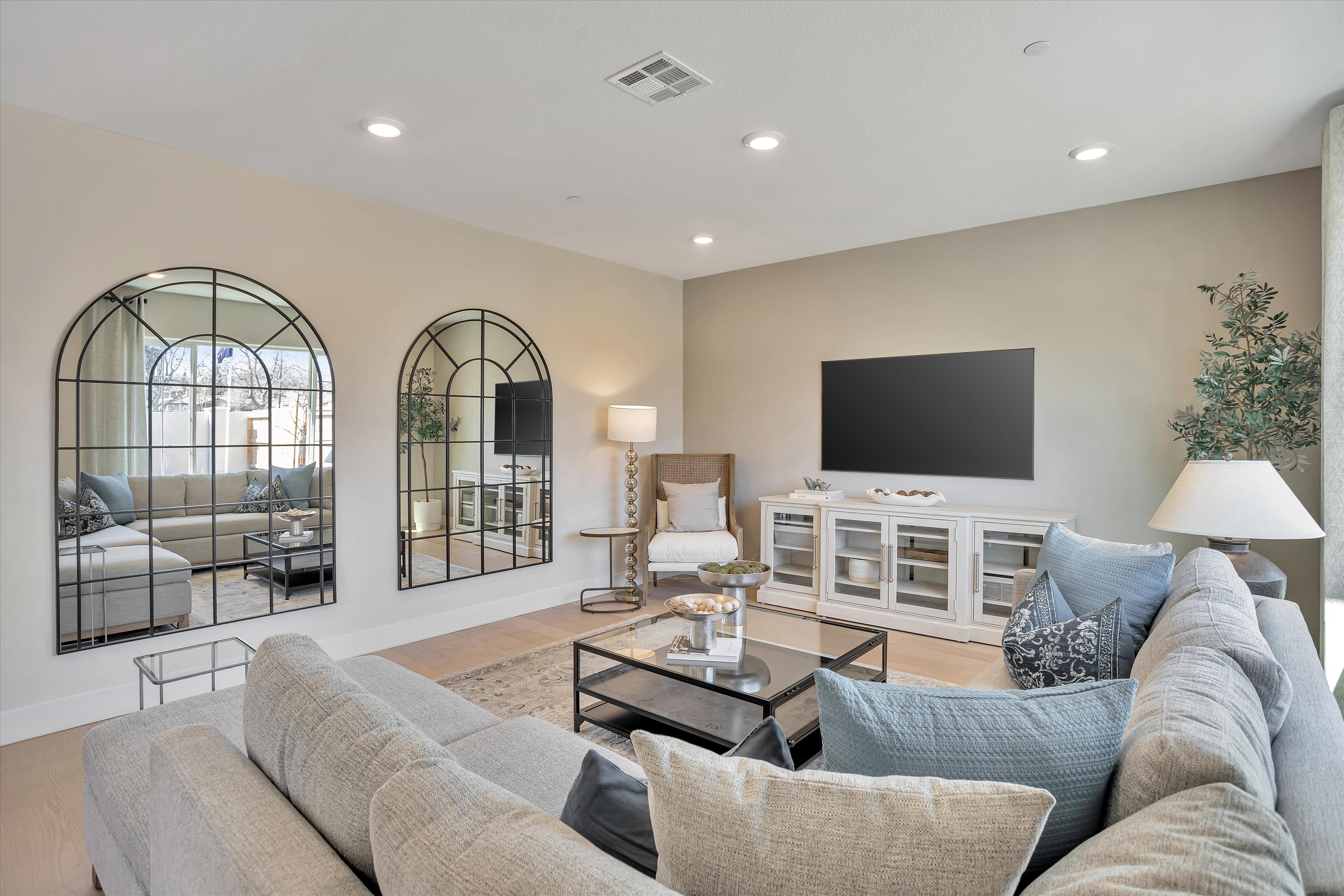 A living room with a tv and couches.