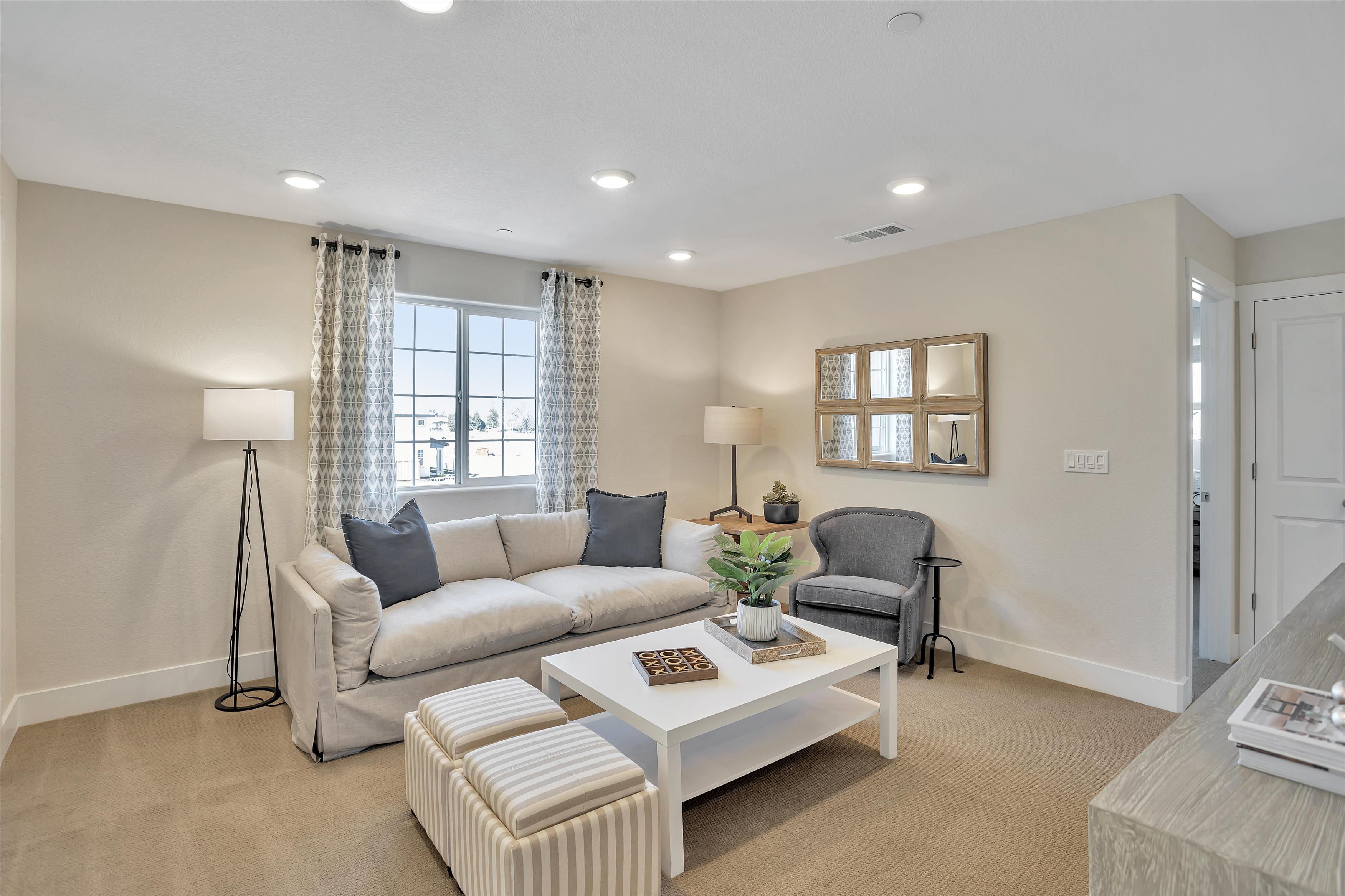 A living room with a couch and a coffee table.