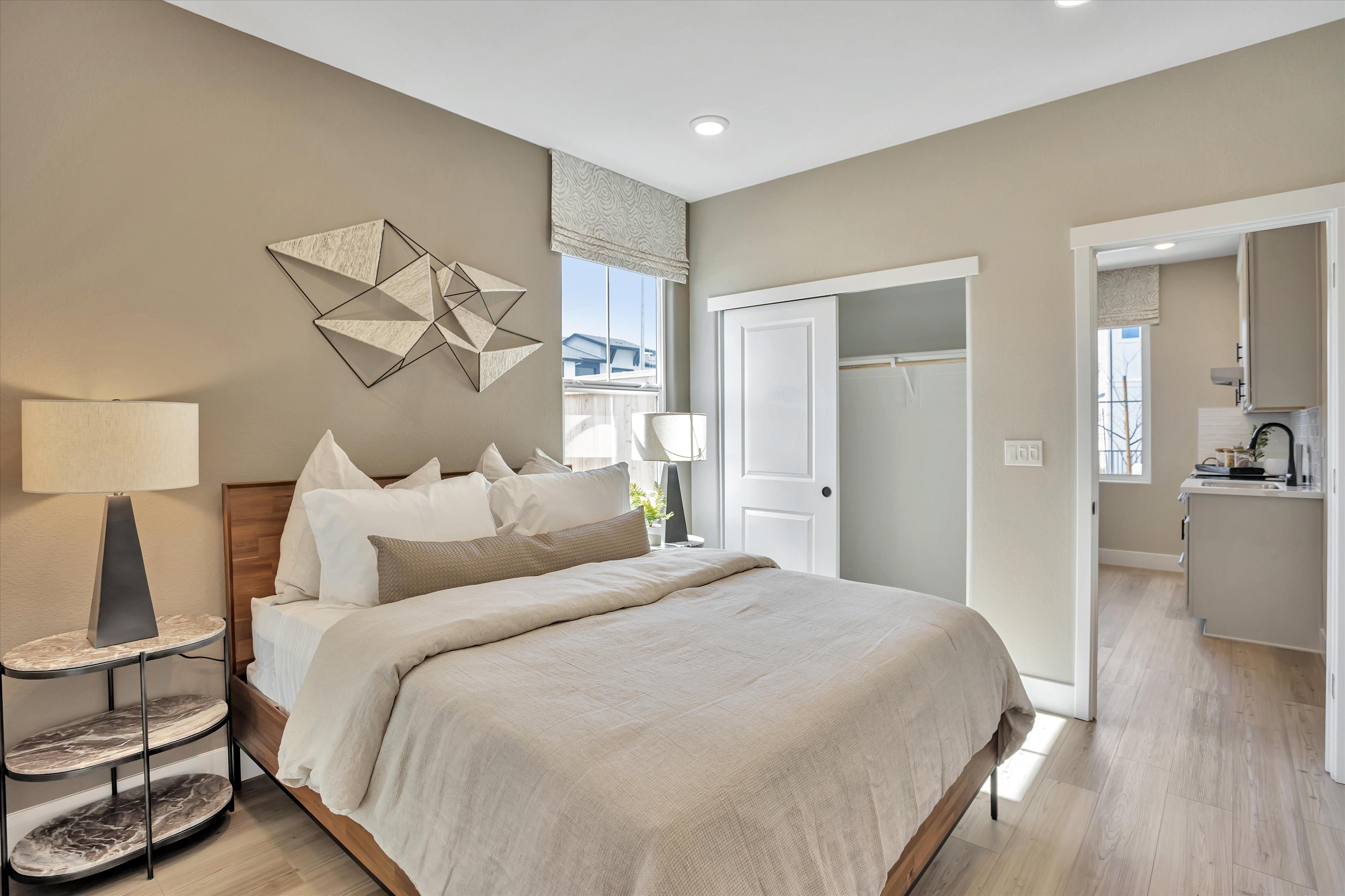 A bedroom with a large bed.