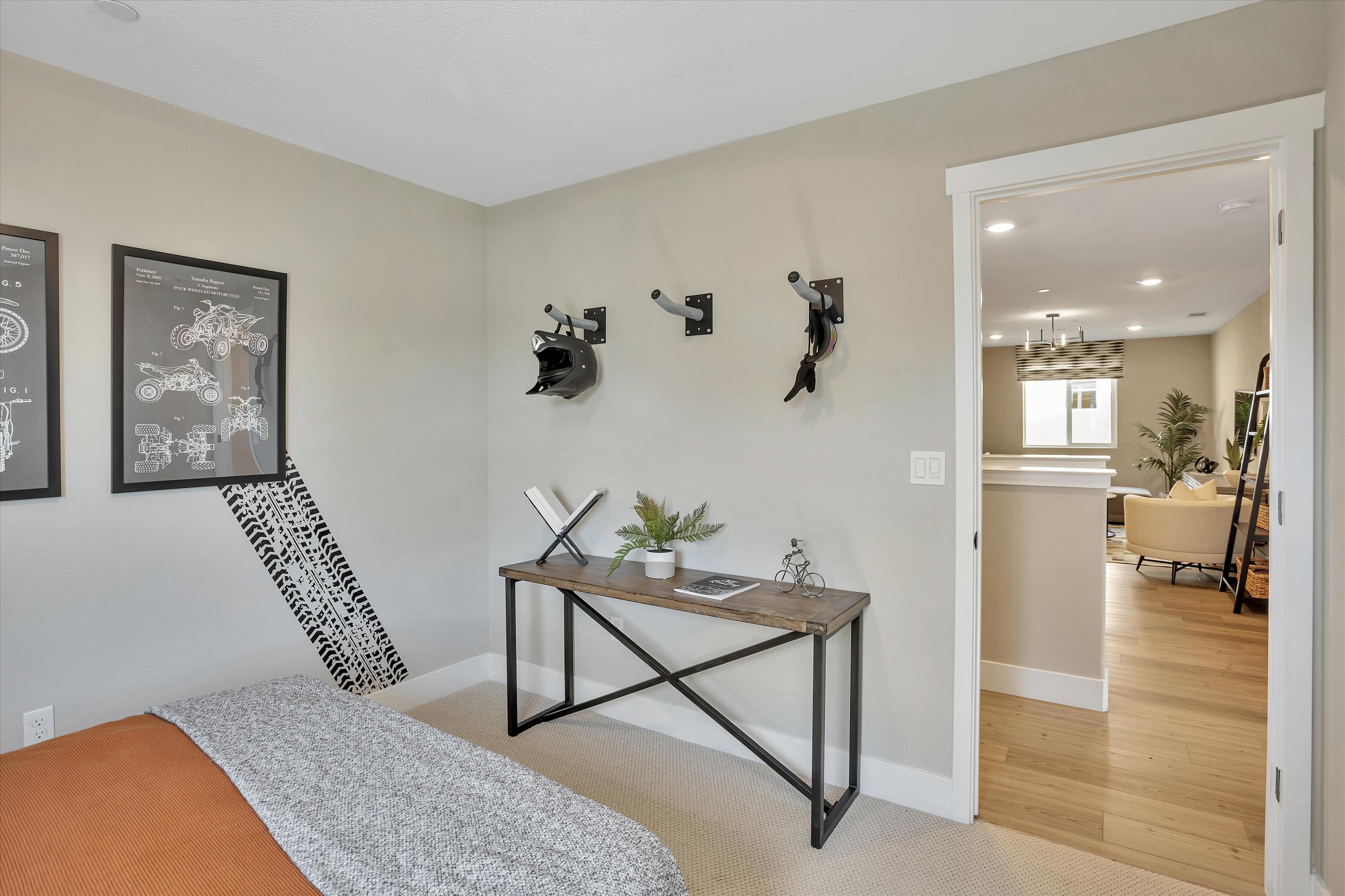 A room with a bed and a table.