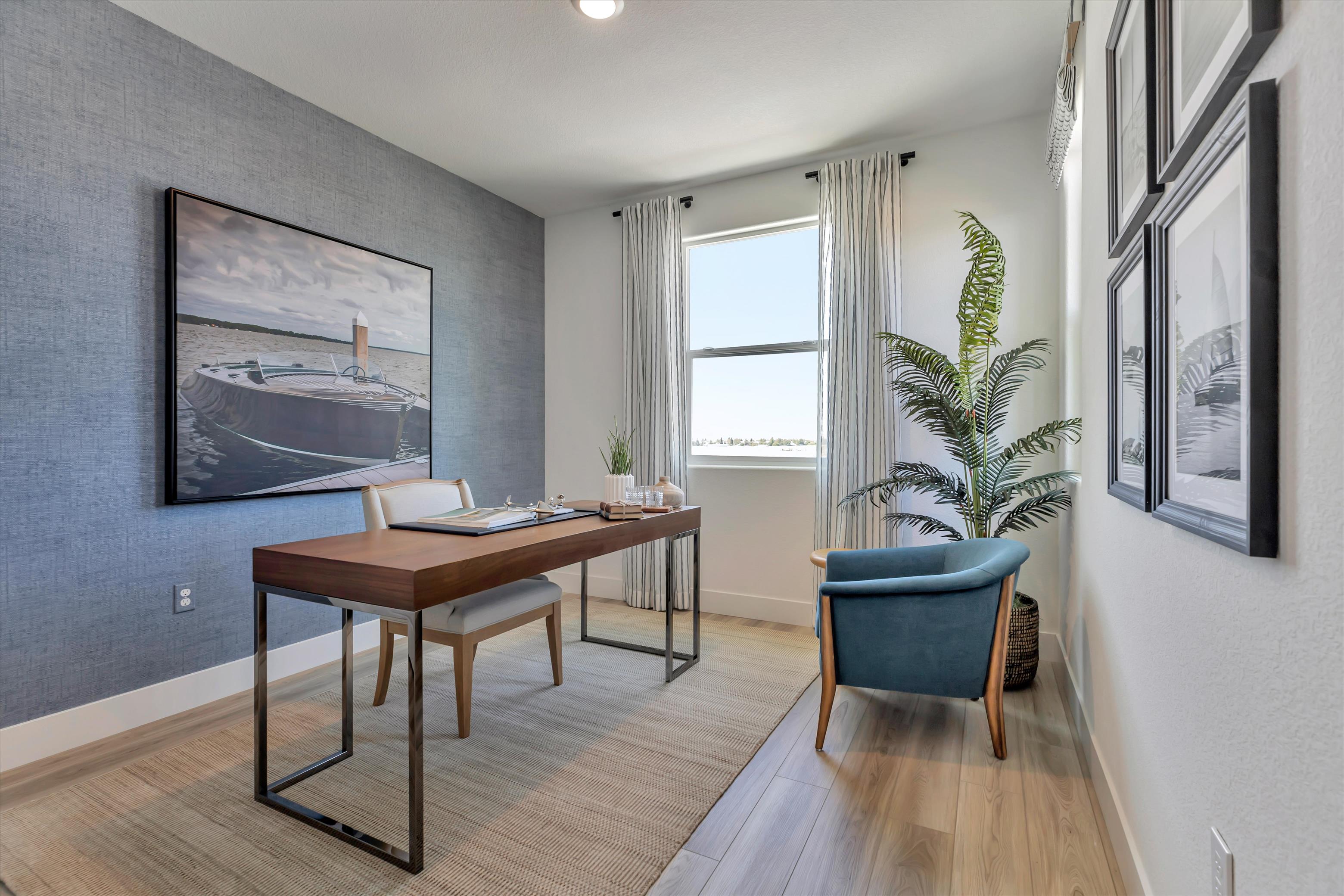 A room with a table and chairs.