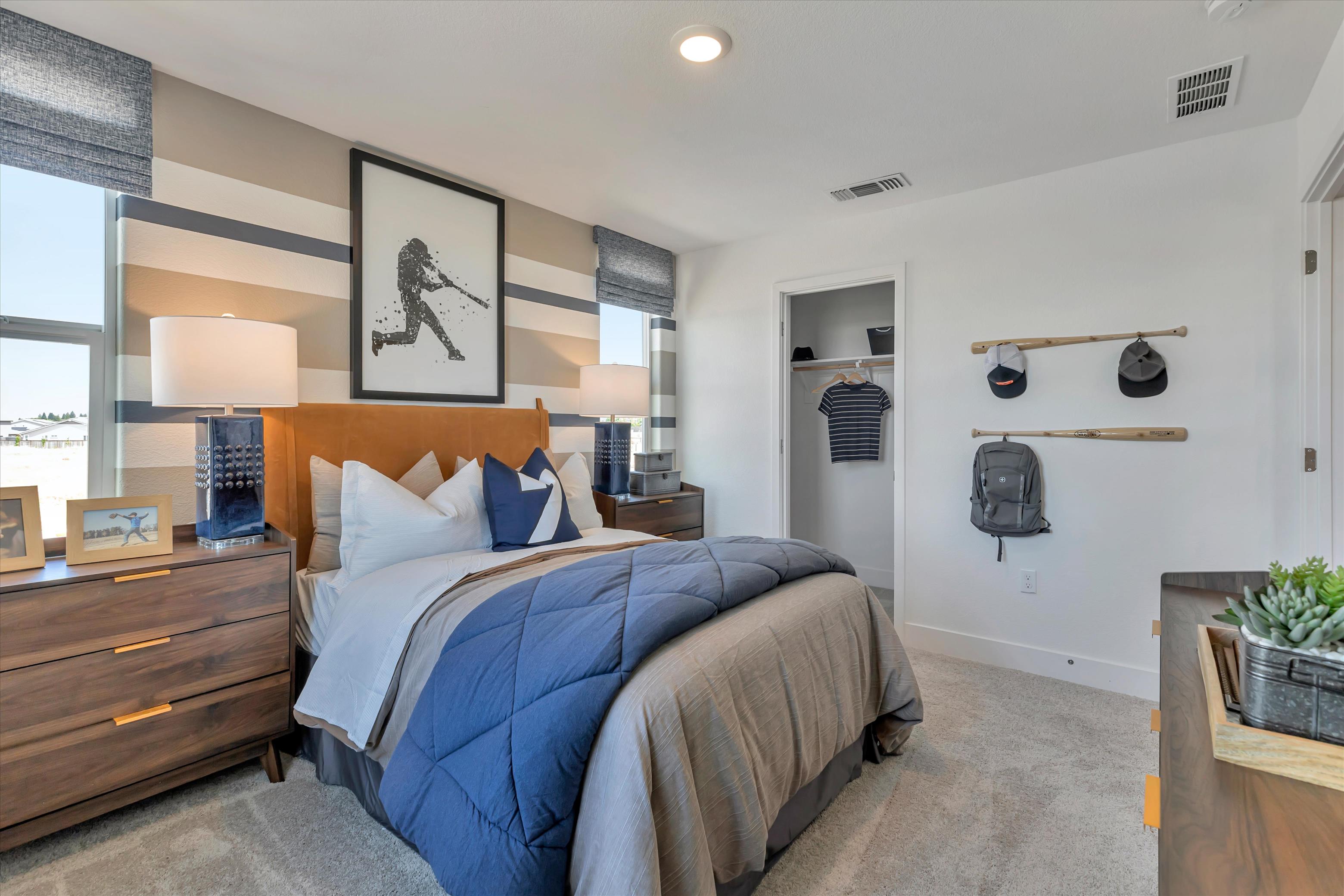 A bedroom with a bed and a shelf with shoes on it.