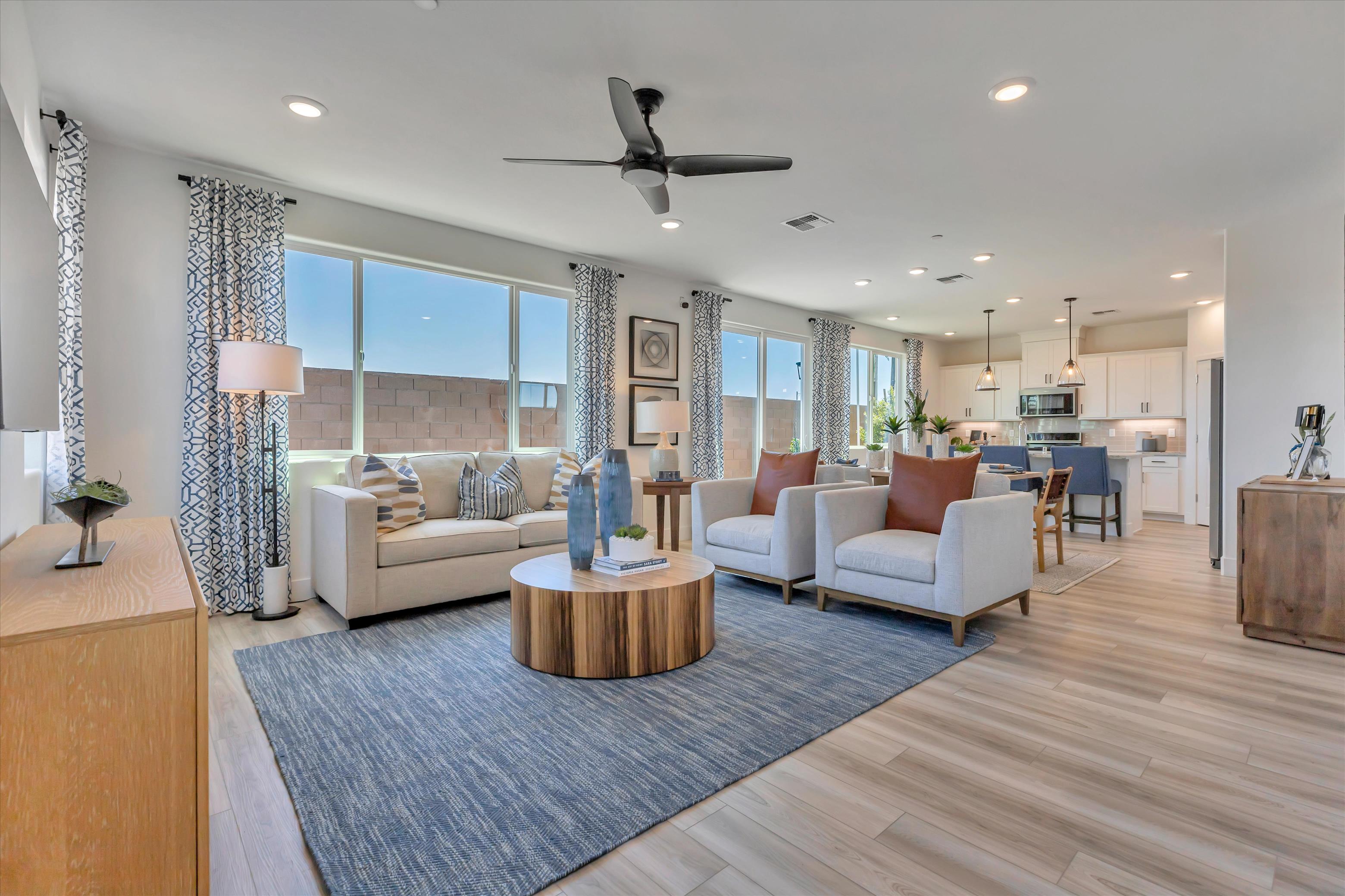 A large living room with a large window.