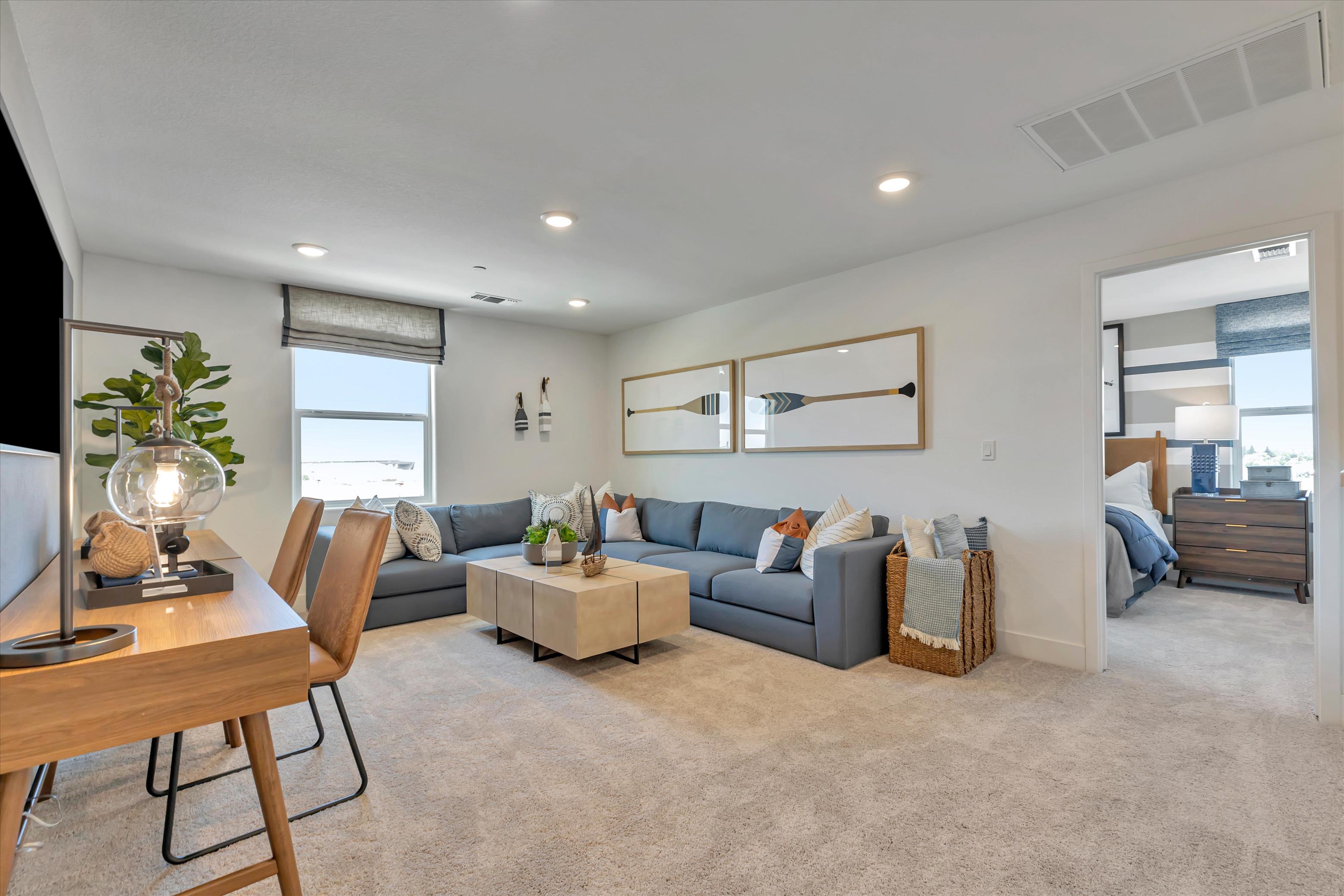 A living room with a couch and a table.