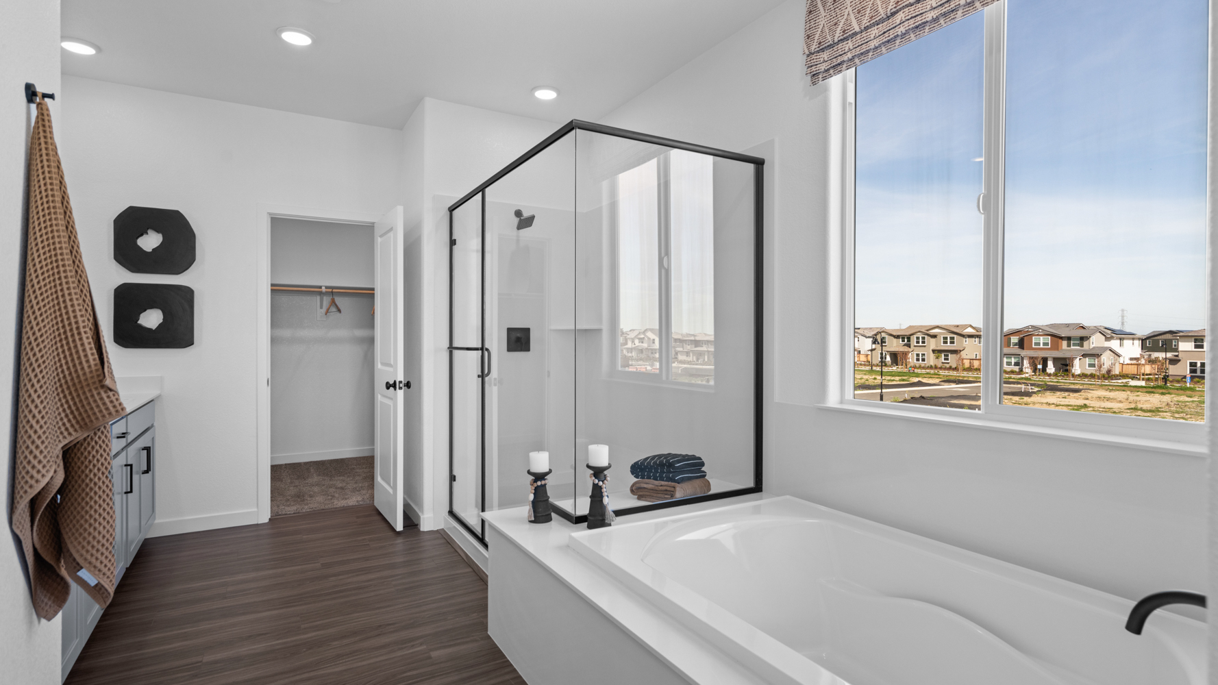 A bathroom with a large glass door.