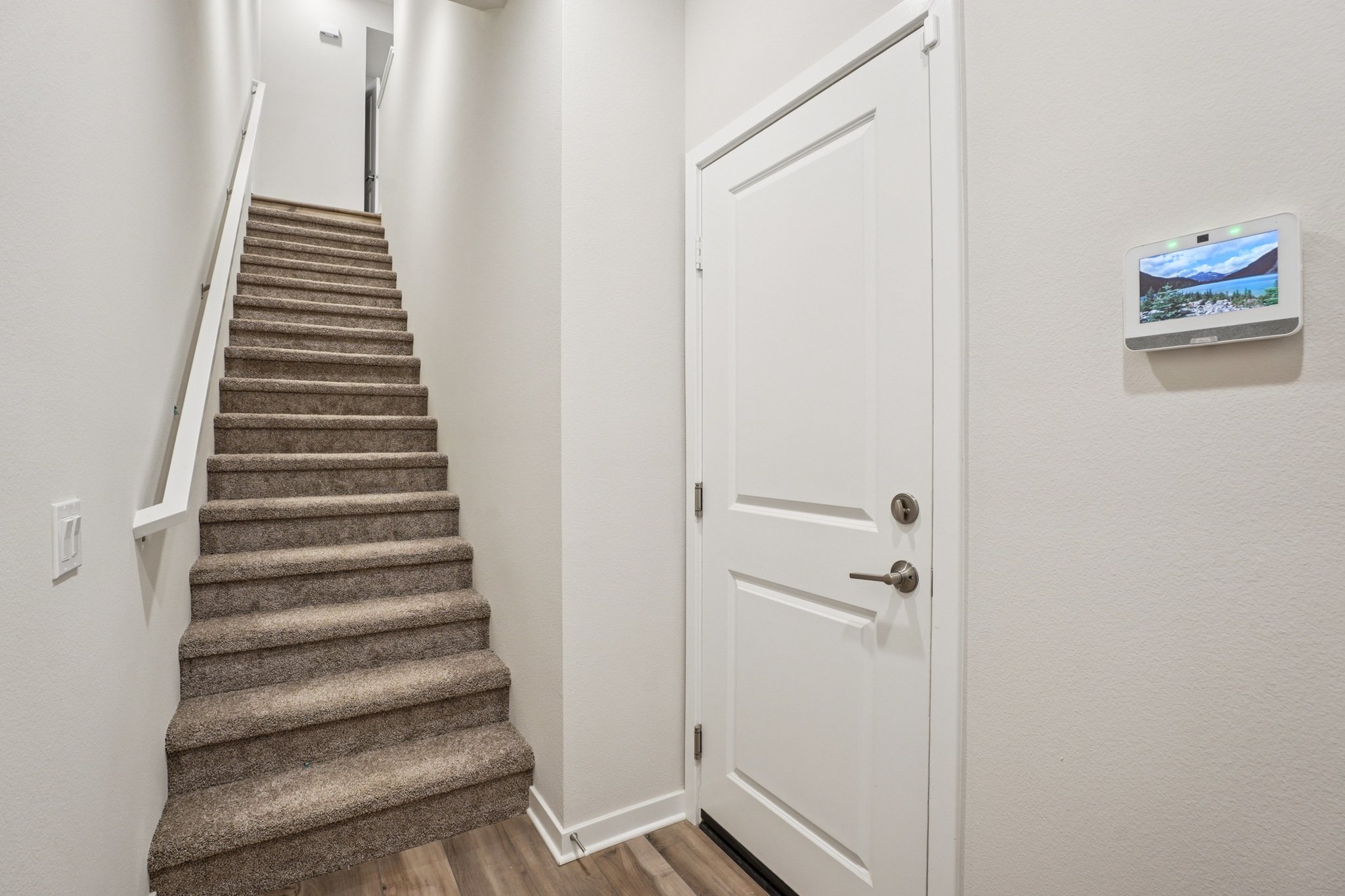 A staircase with white doors.