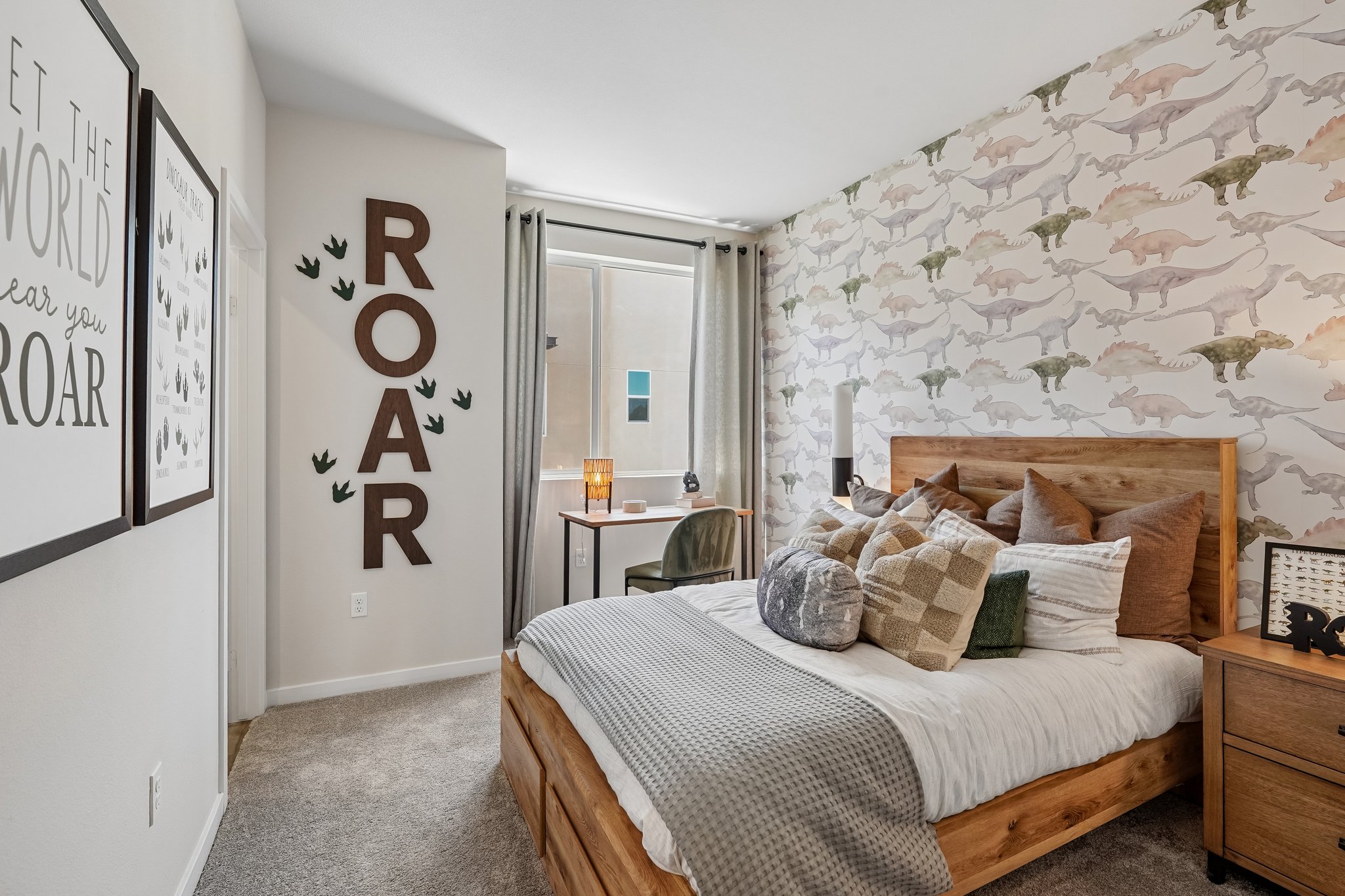 A bedroom with a bed and a desk.
