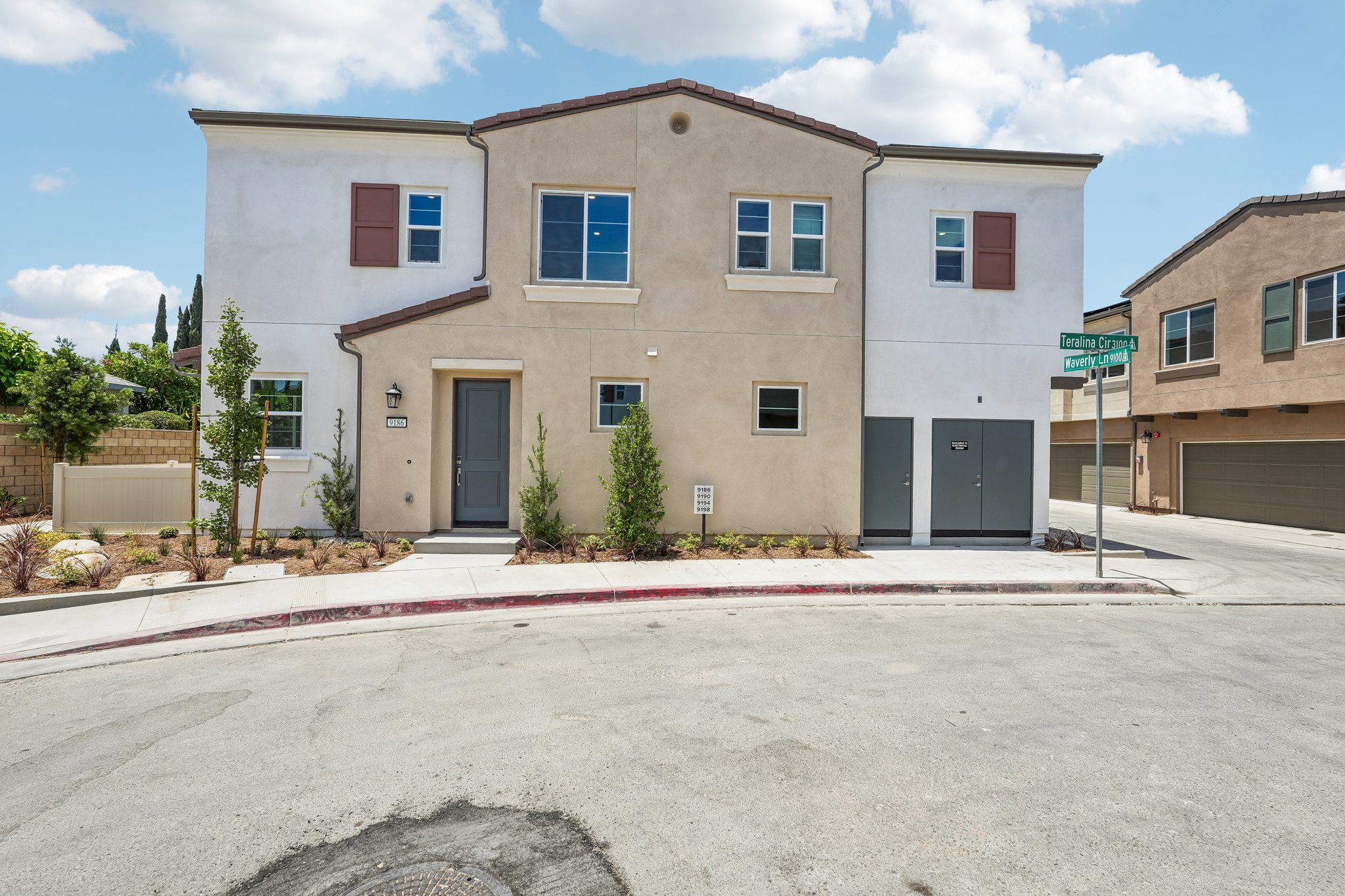 A building with a sign in front.