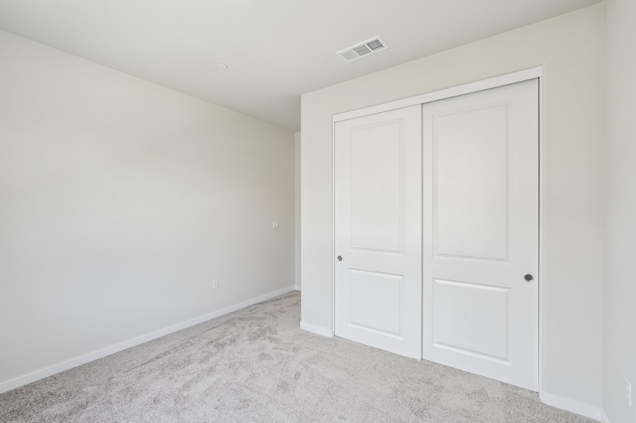 A room with white doors.