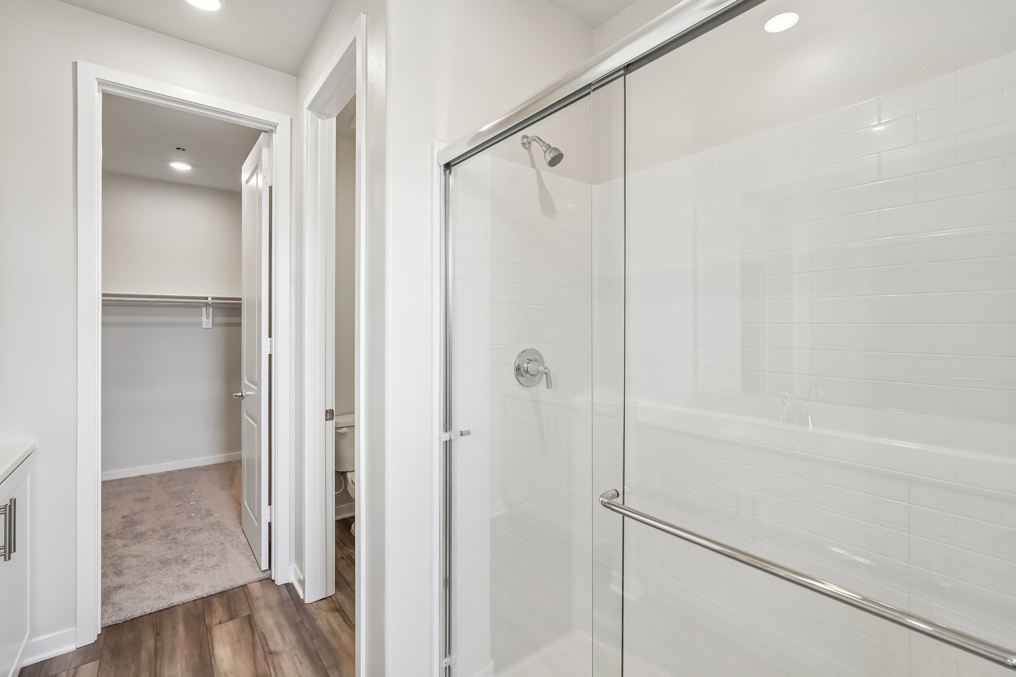 A bathroom with a shower unit.