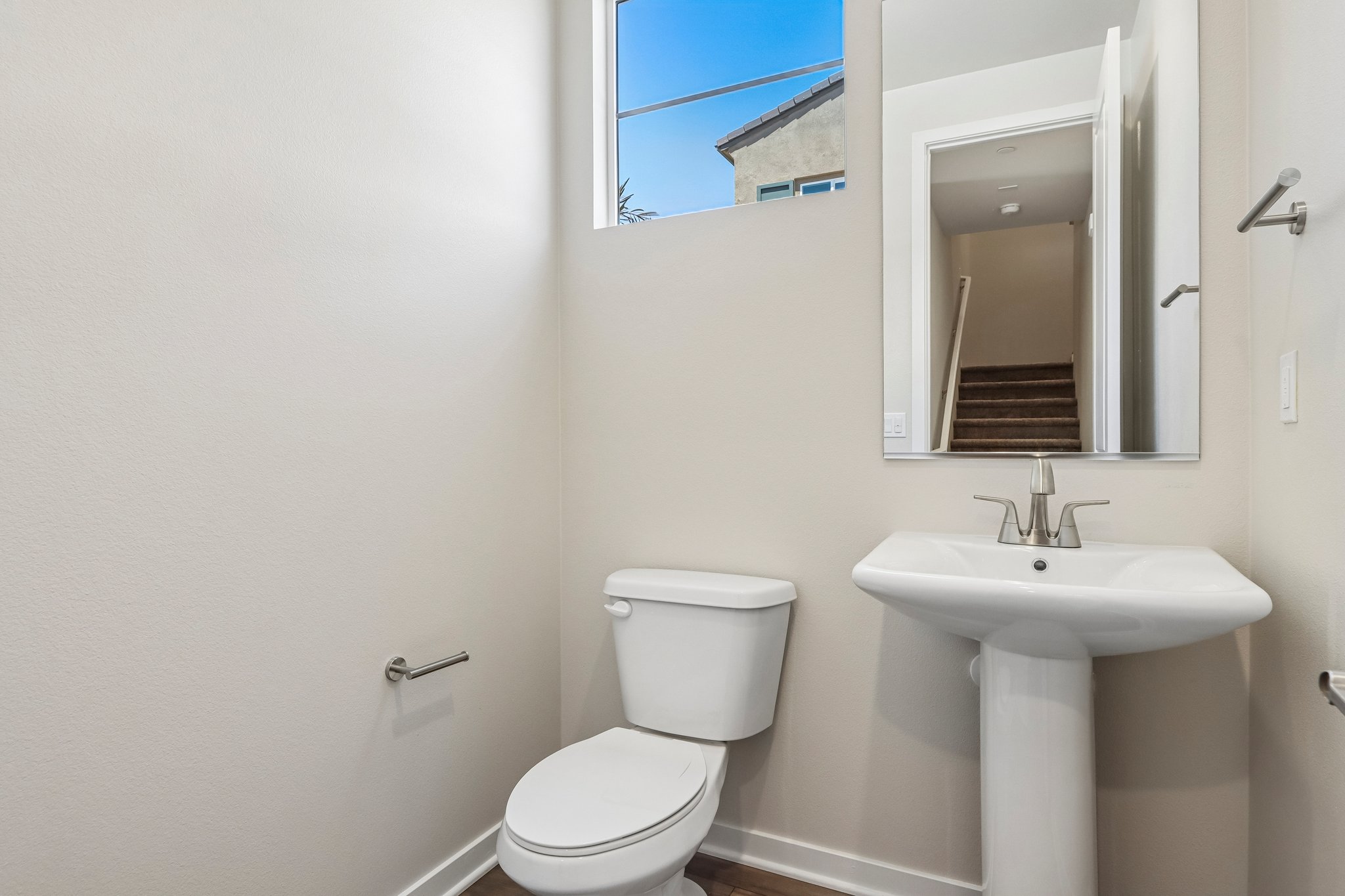 A bathroom with a sink and toilet.