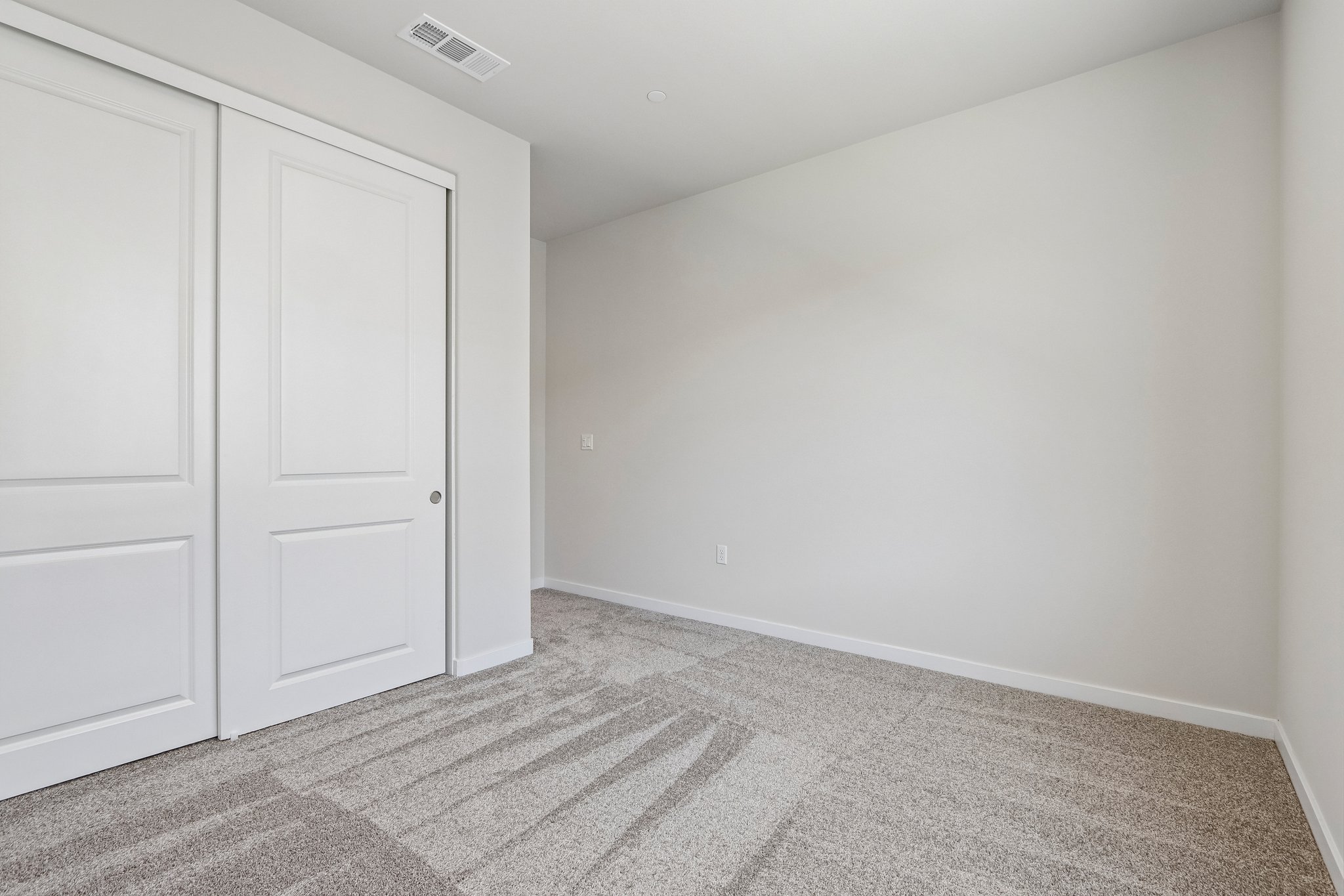 A room with white doors.