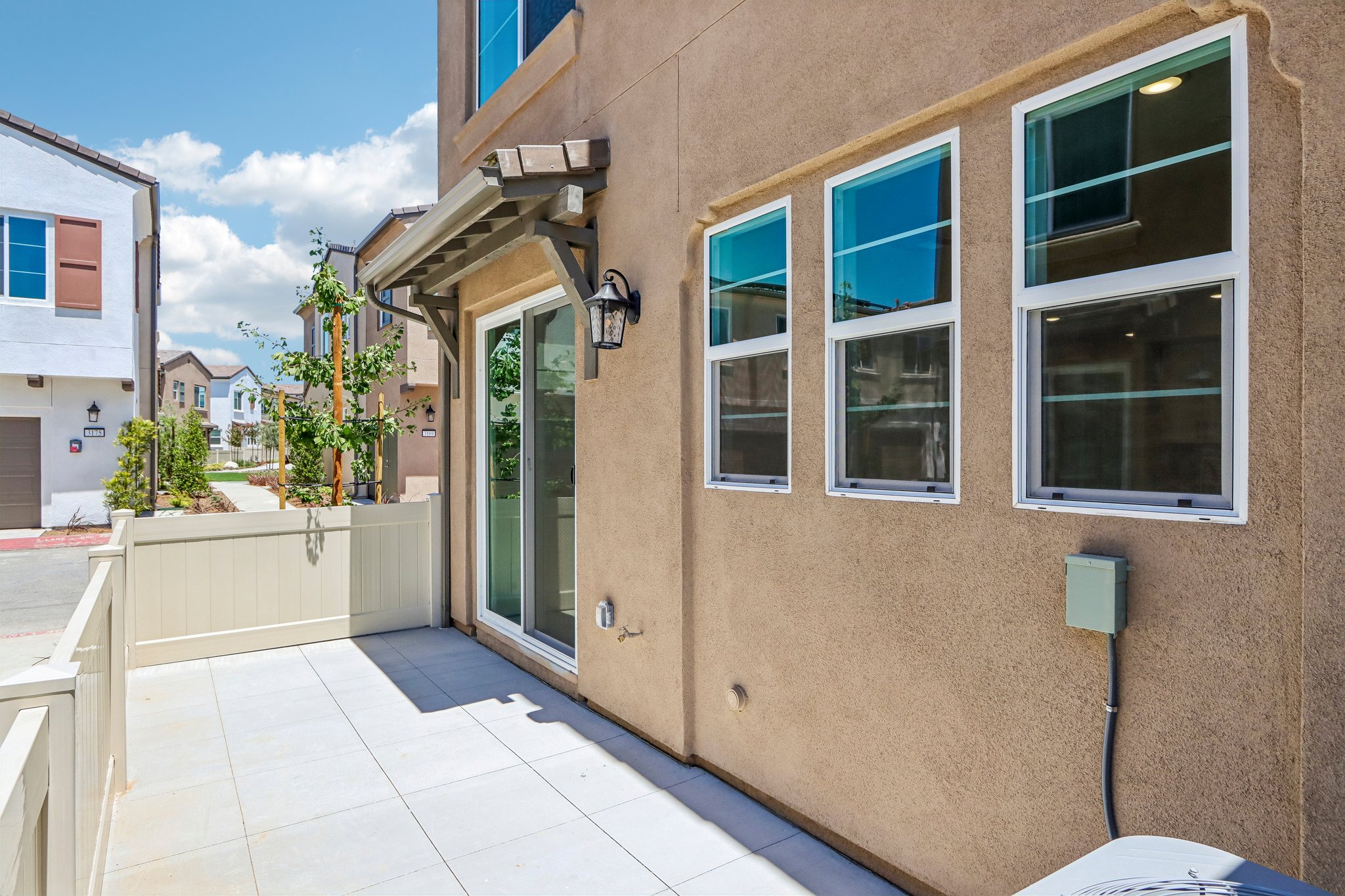 A building with windows and a patio.