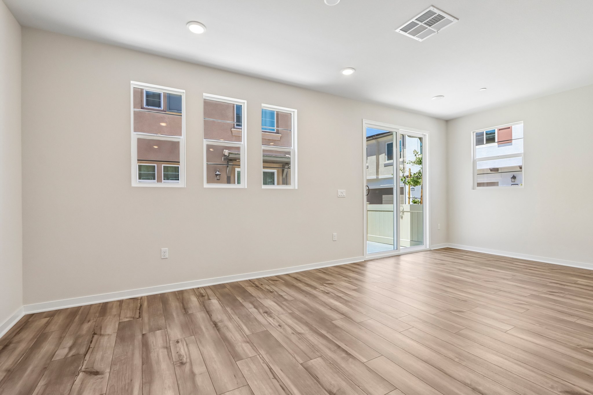 A room with a wood floor and a wood floor.