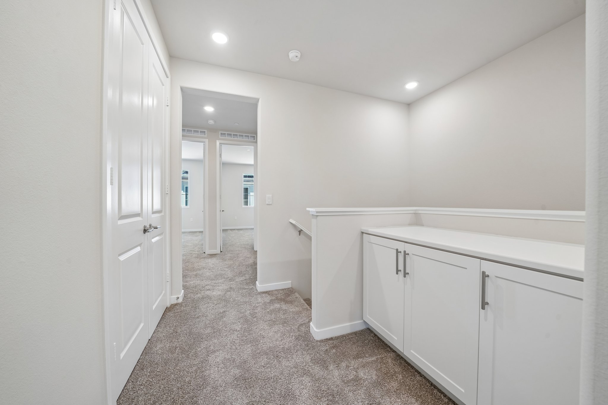 A room with white cabinets.
