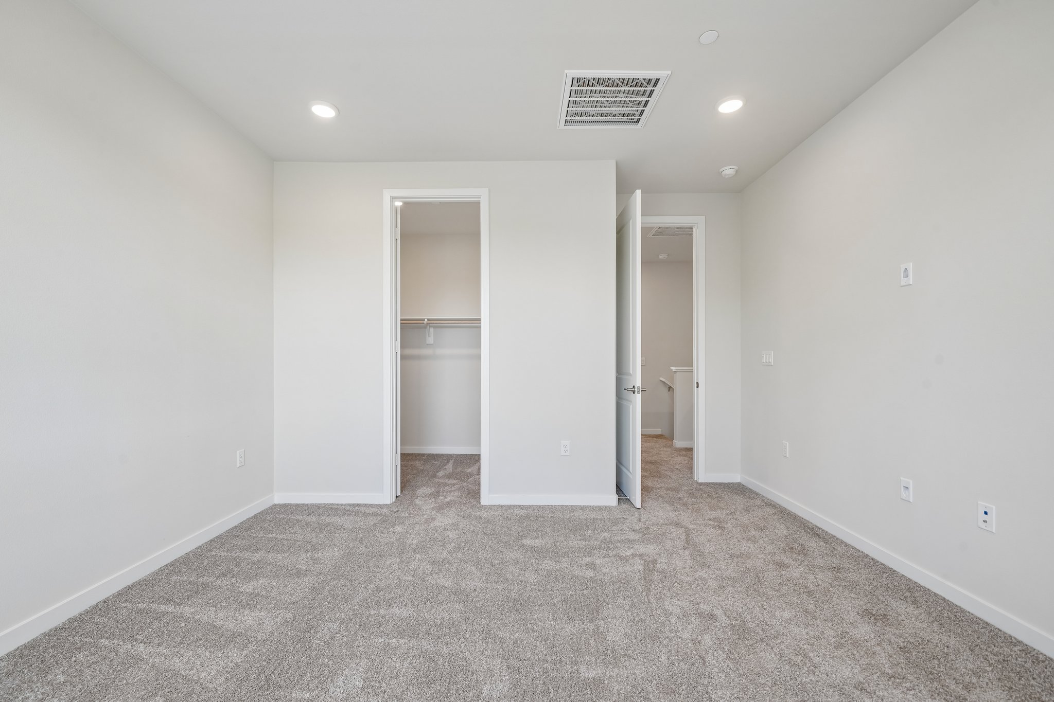 A room with a door and a glass window.