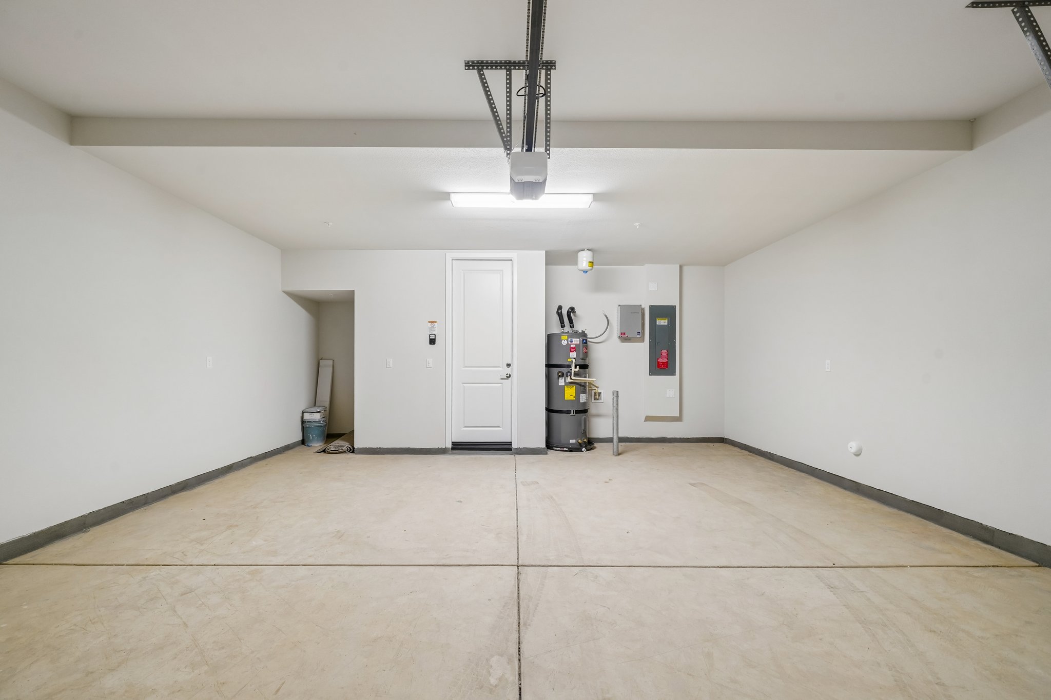 A room with white walls and a white door.