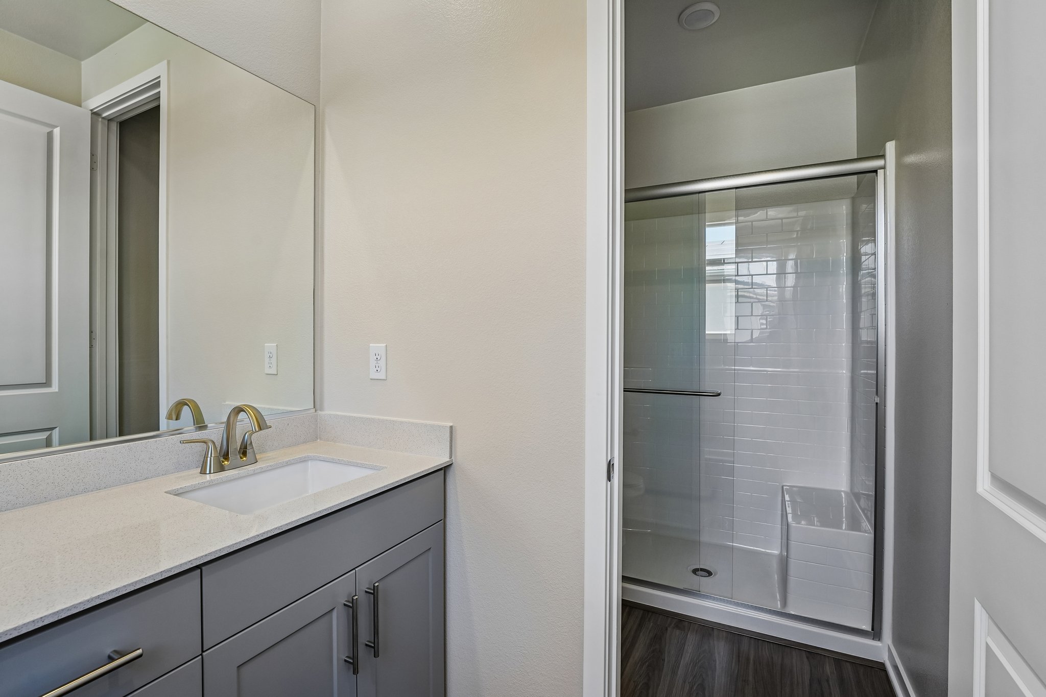 A bathroom with a glass shower.