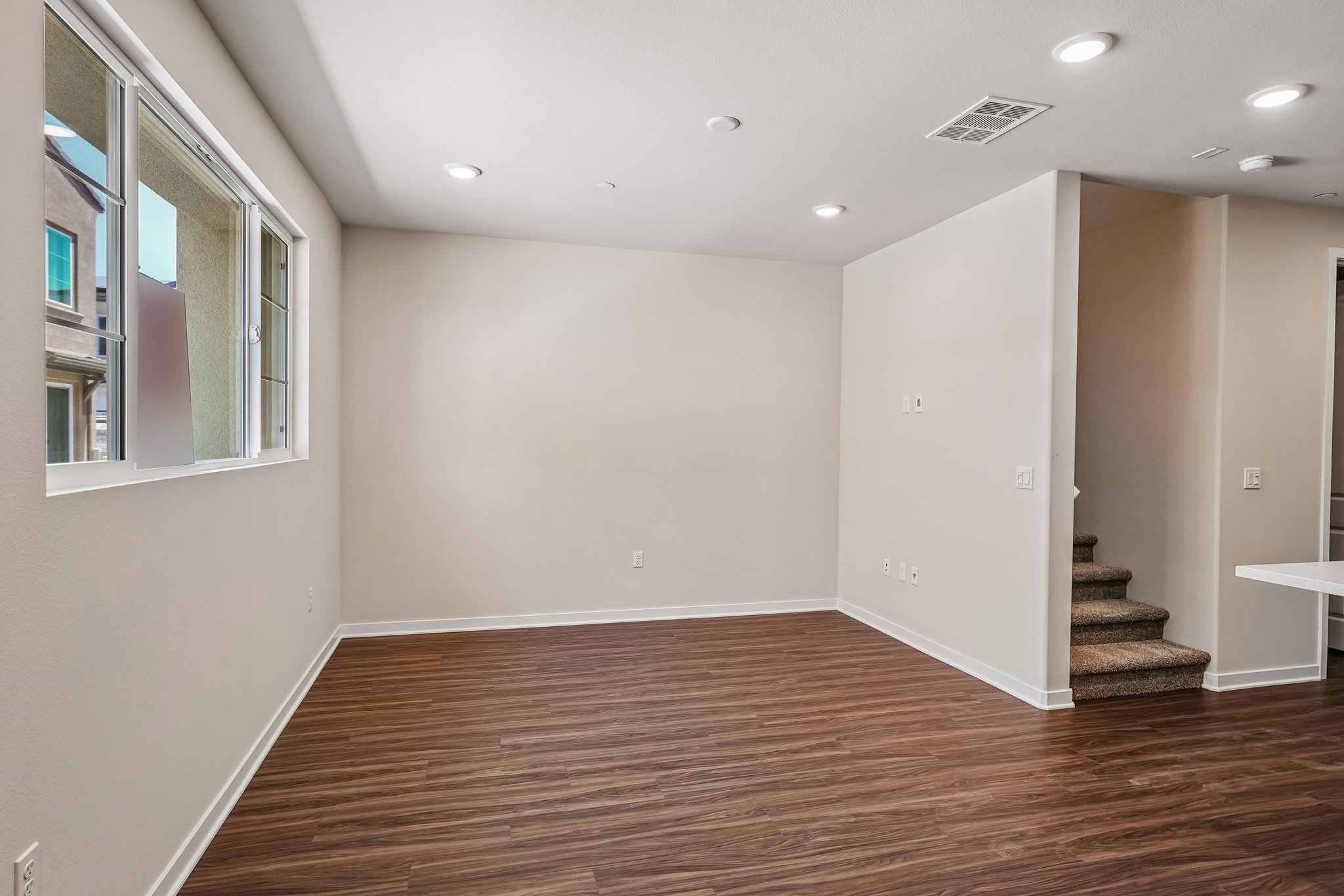 A room with a wood floor and a wood floor.