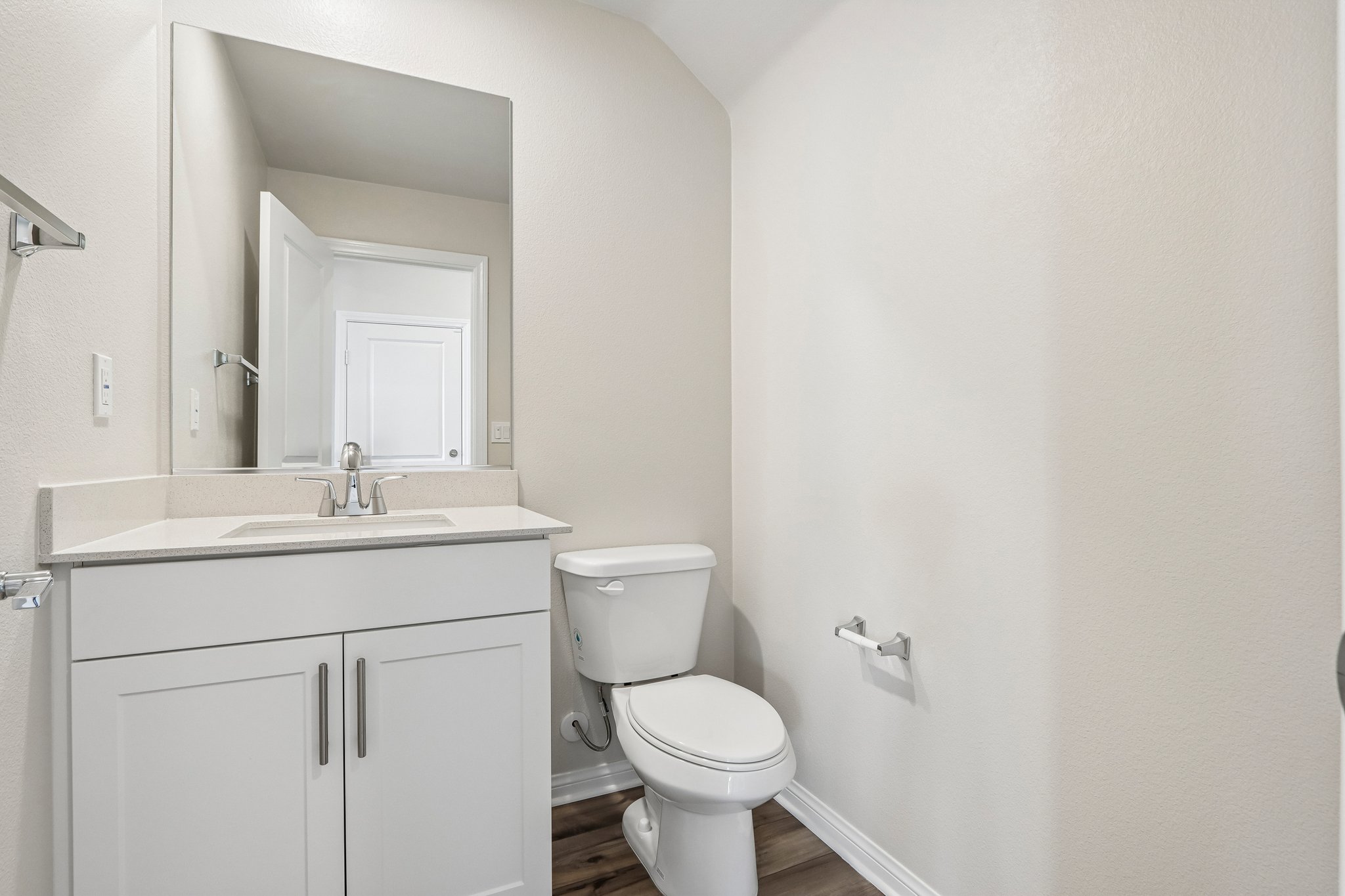 A bathroom with a toilet and sink.