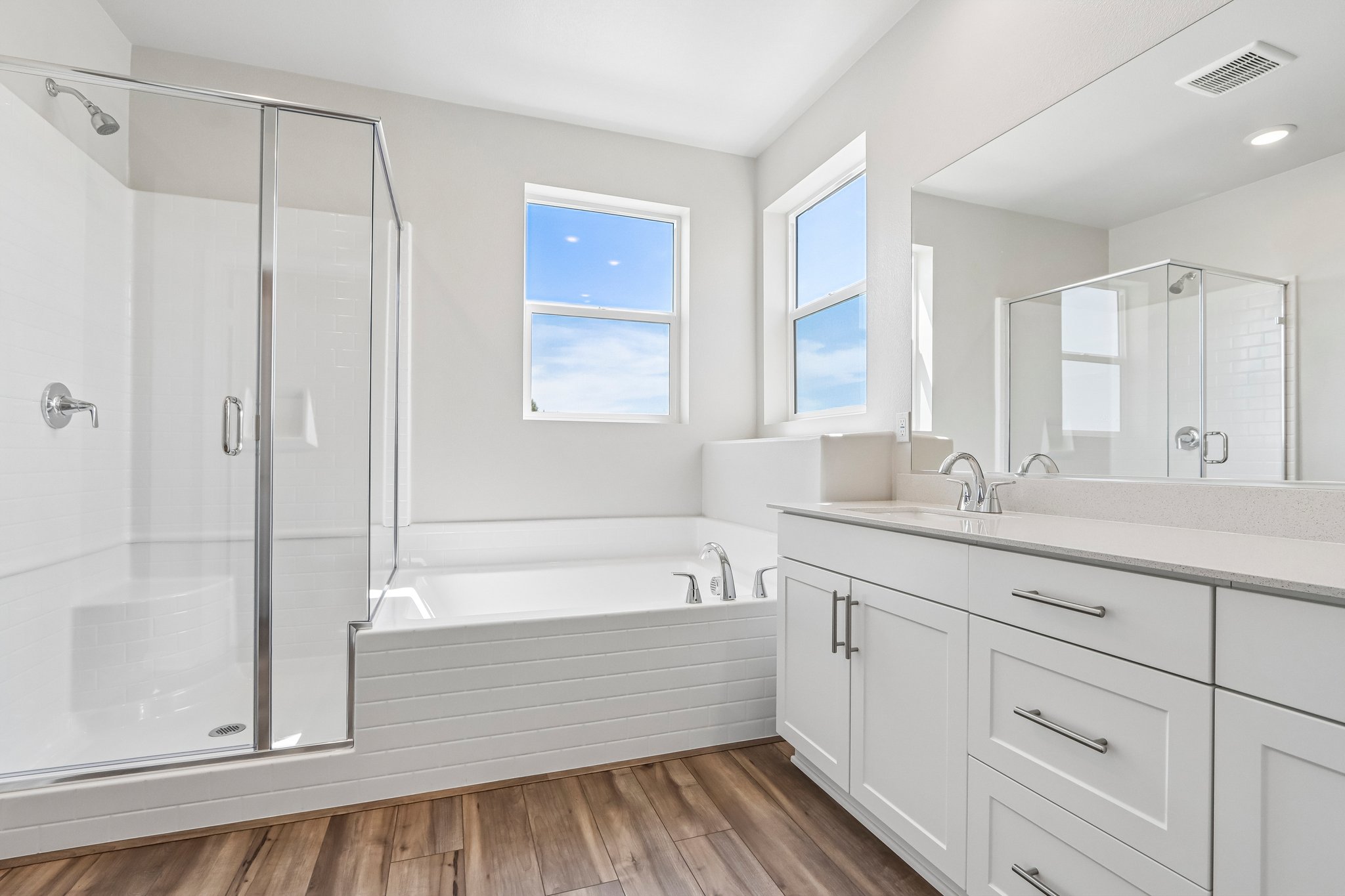 A bathroom with a glass shower.