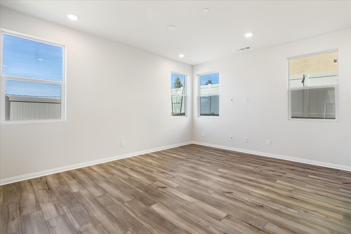A room with a wood floor and a wood floor with a wood floor.