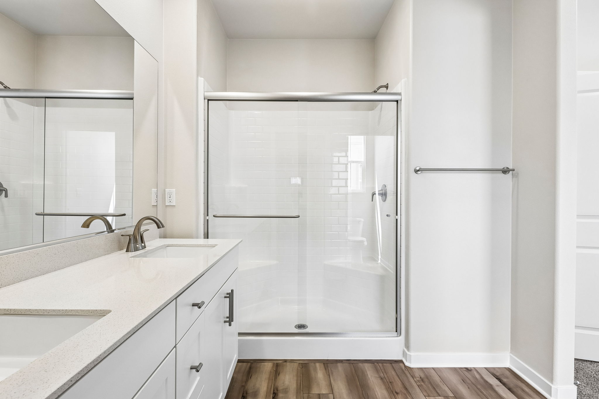 A bathroom with a glass shower.