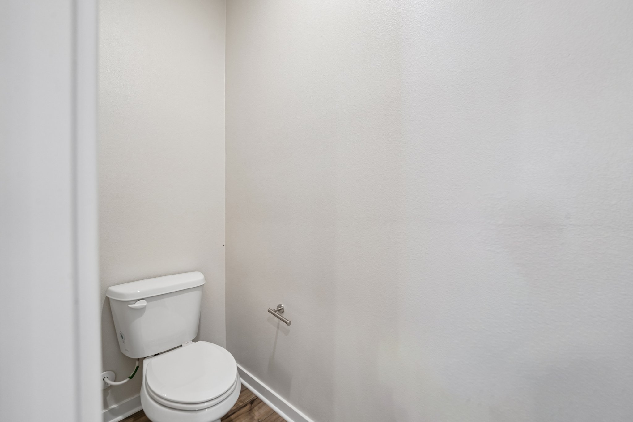 A toilet in a bathroom.