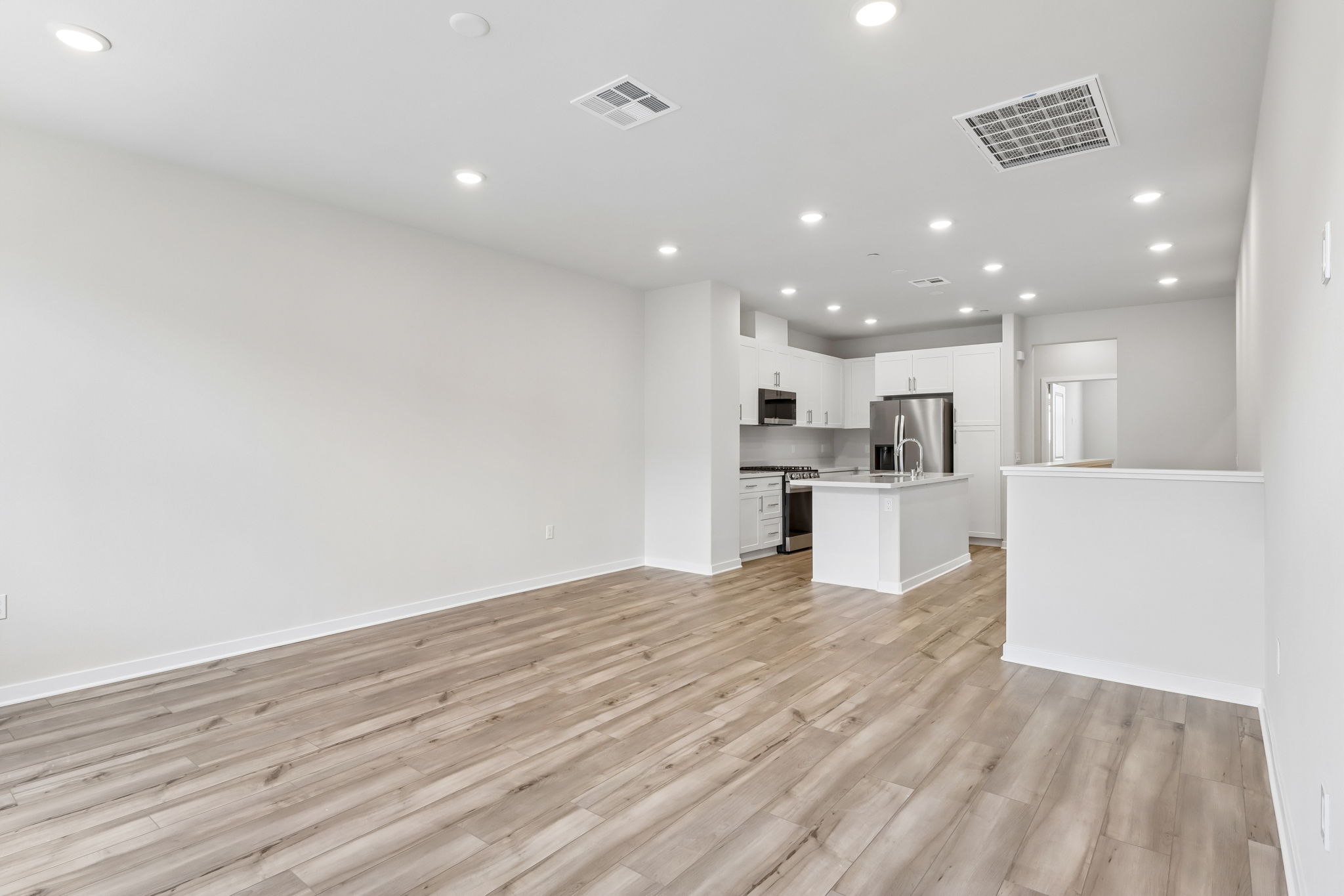 A kitchen with white walls.
