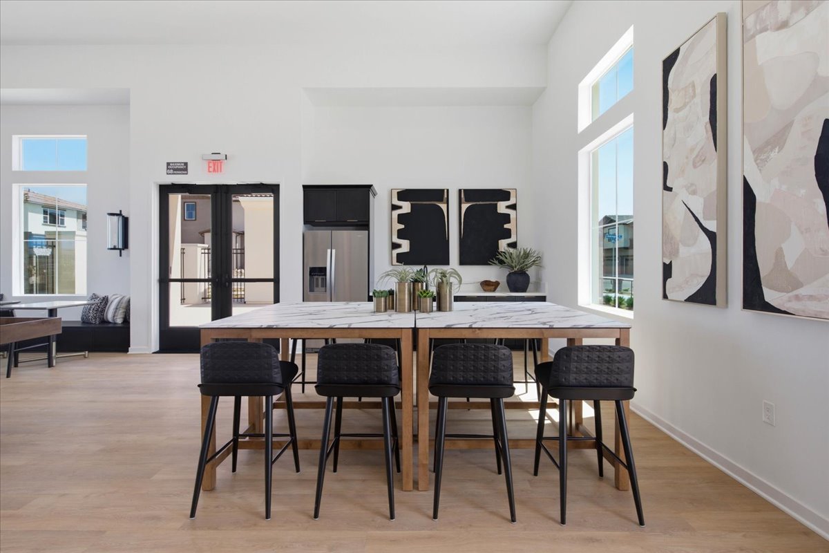 A room with a table and chairs.