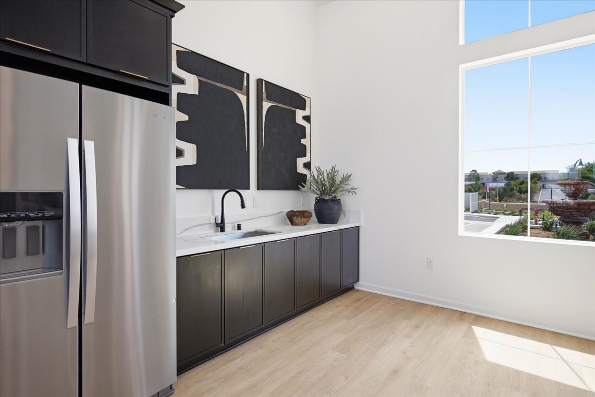 A kitchen with a black countertop.
