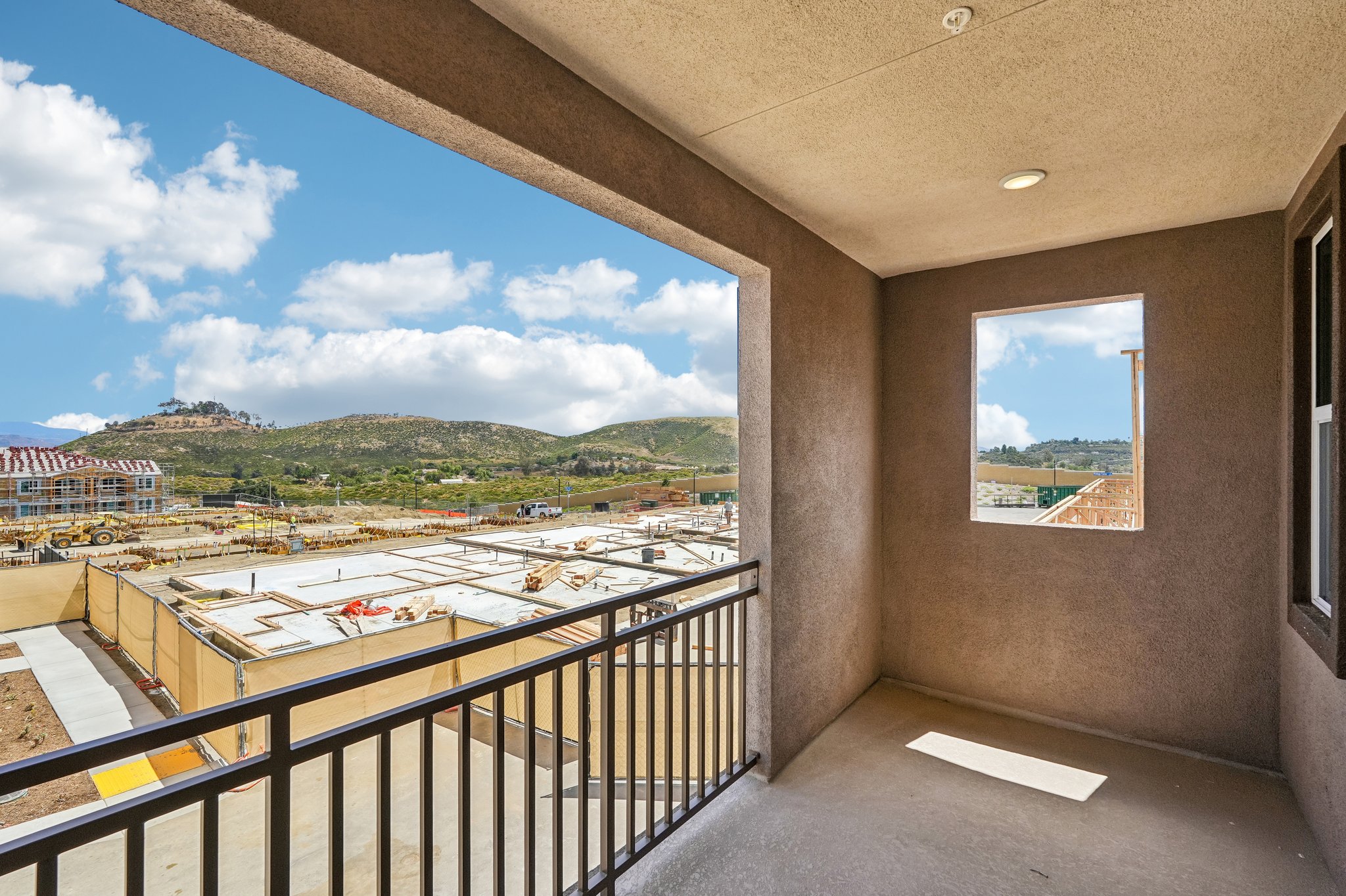 A balcony overlooking a city.