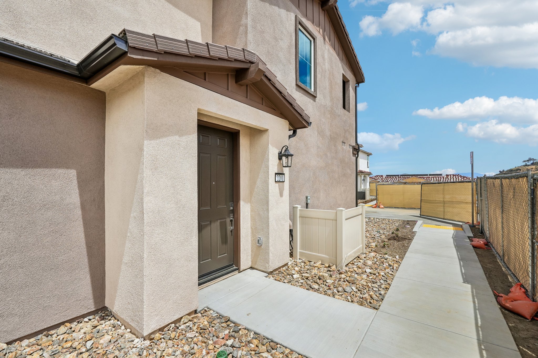 A building with a door and a fence around it.