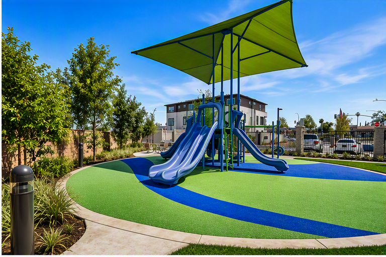 A large blue and green trampoline in a park.
