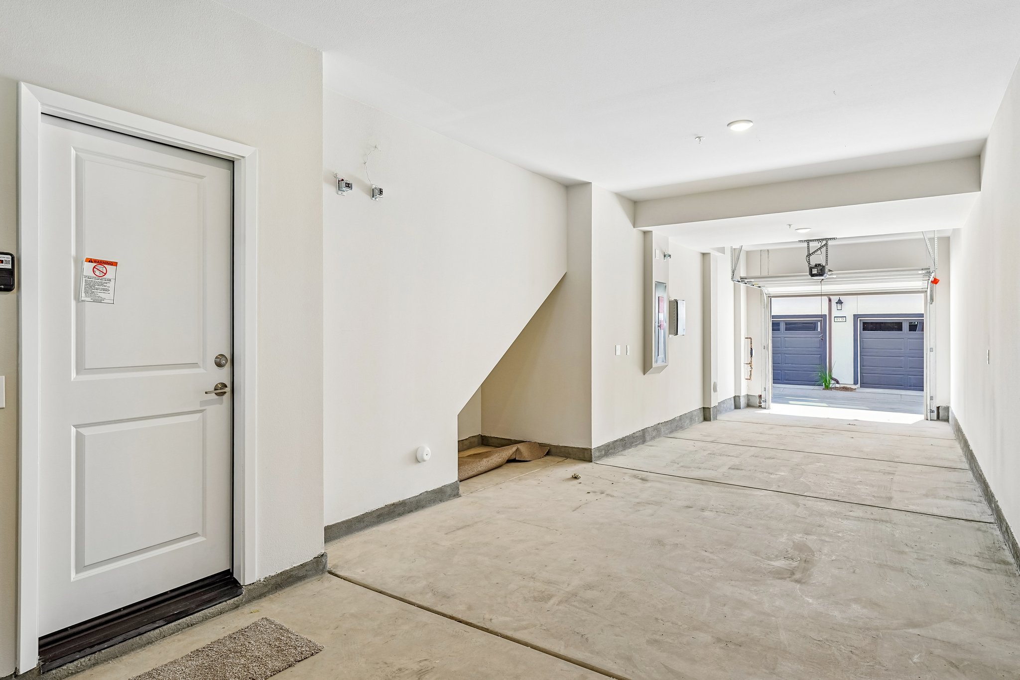A hallway with white doors.