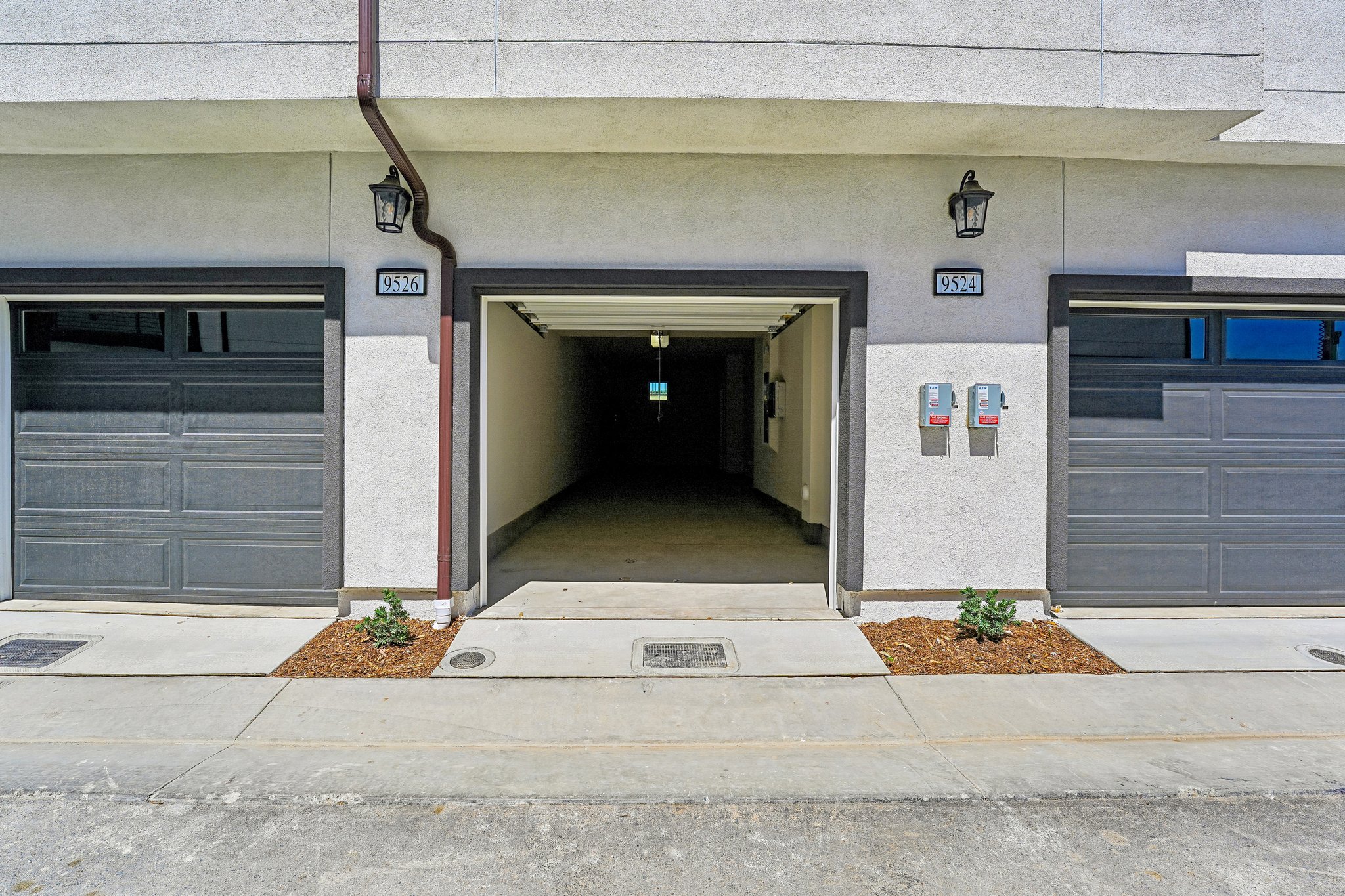 A garage with doors and windows.