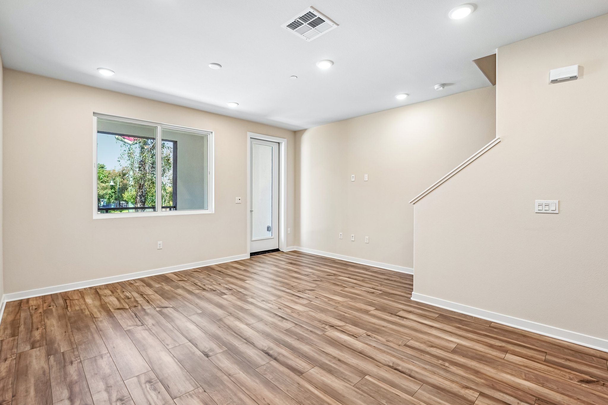 A room with a wood floor and a wood floor.