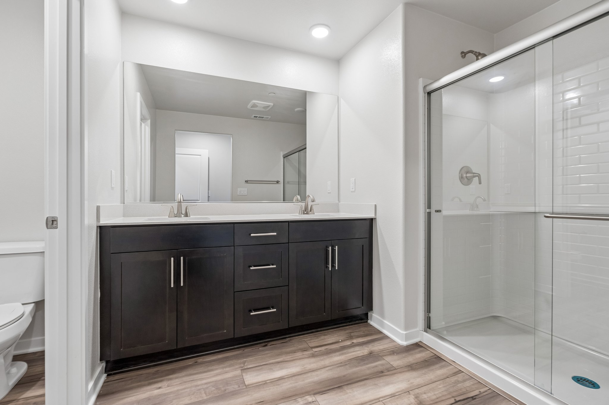 A bathroom with a glass shower.