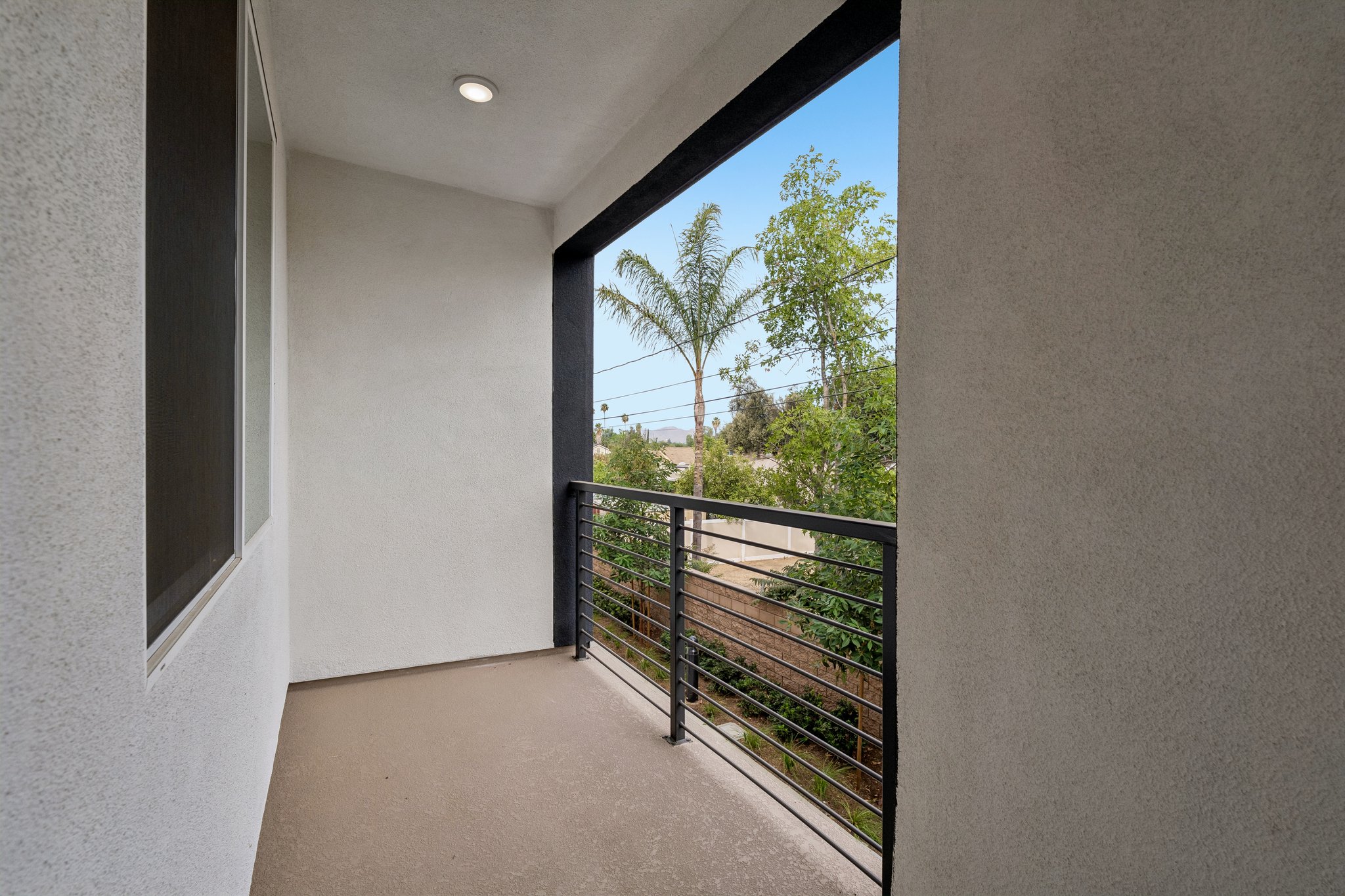 A room with a gate and trees.